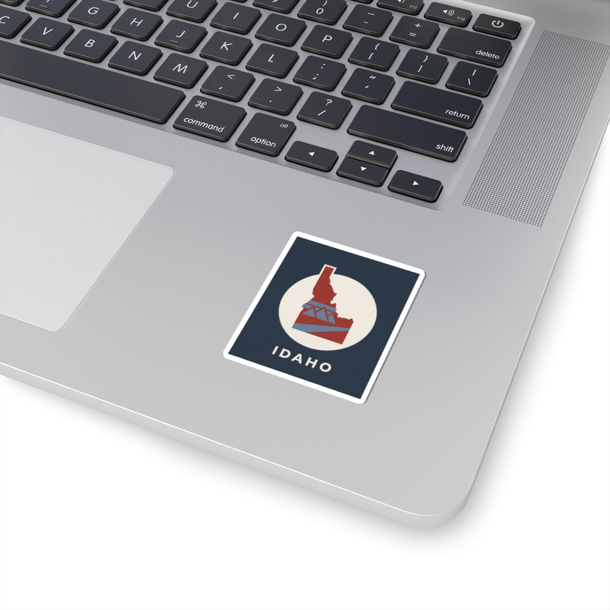 Square Idaho state silhouette sticker with retro red and blue geometric graphic