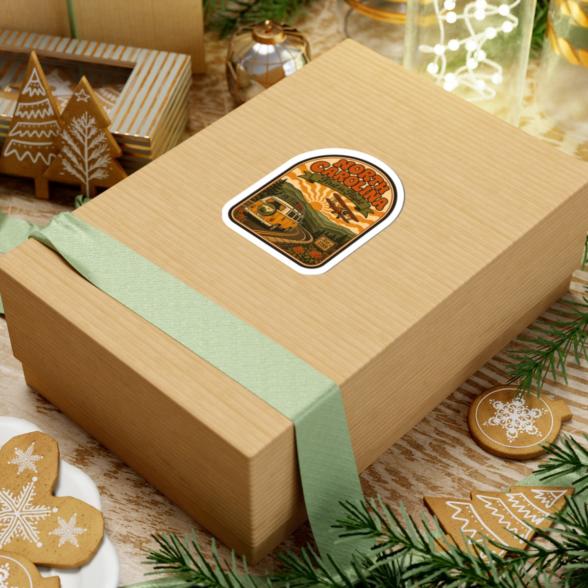 North Carolina vintage van and biplane round sticker on a wrapped gift box
