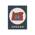 Oregon metal silhouette wall sign with circular tree graphic and “OREGON” text