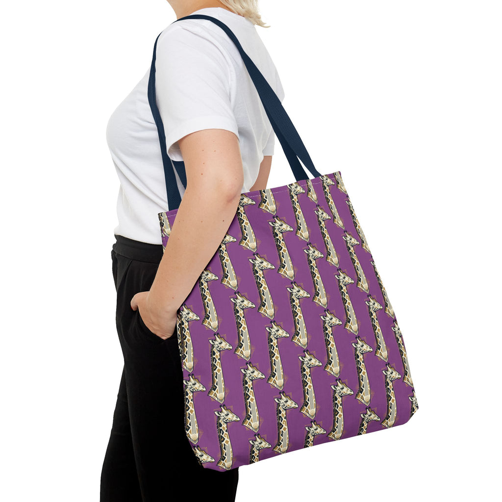 Purple tote bag with repeating saxophone pattern and navy handles, side view on shoulder.