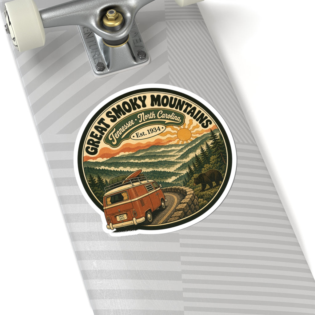 Round sticker with black border and vintage camper van on a rocky path among pine trees