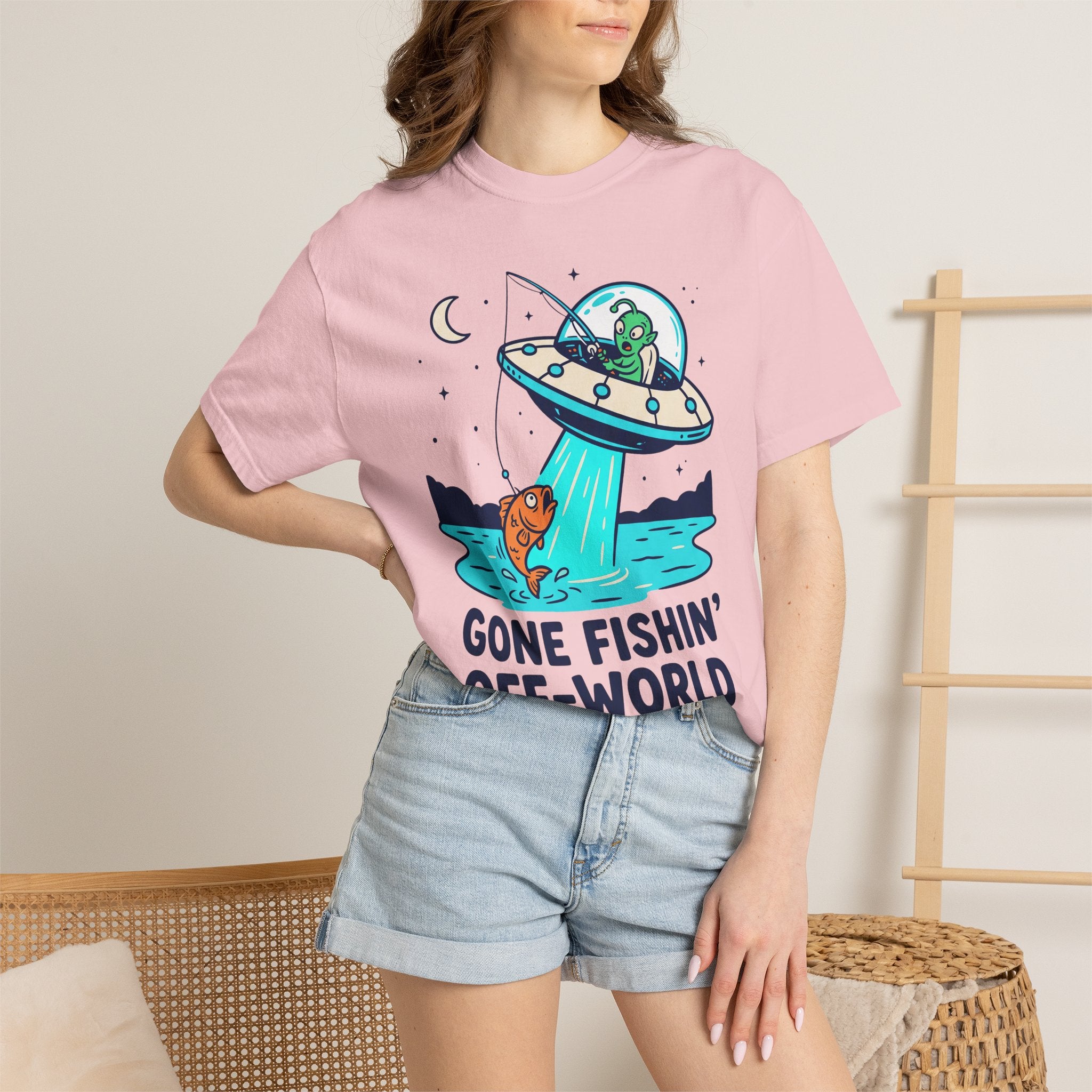 Light pink graphic alien fishing t-shirt with UFO and fish illustration