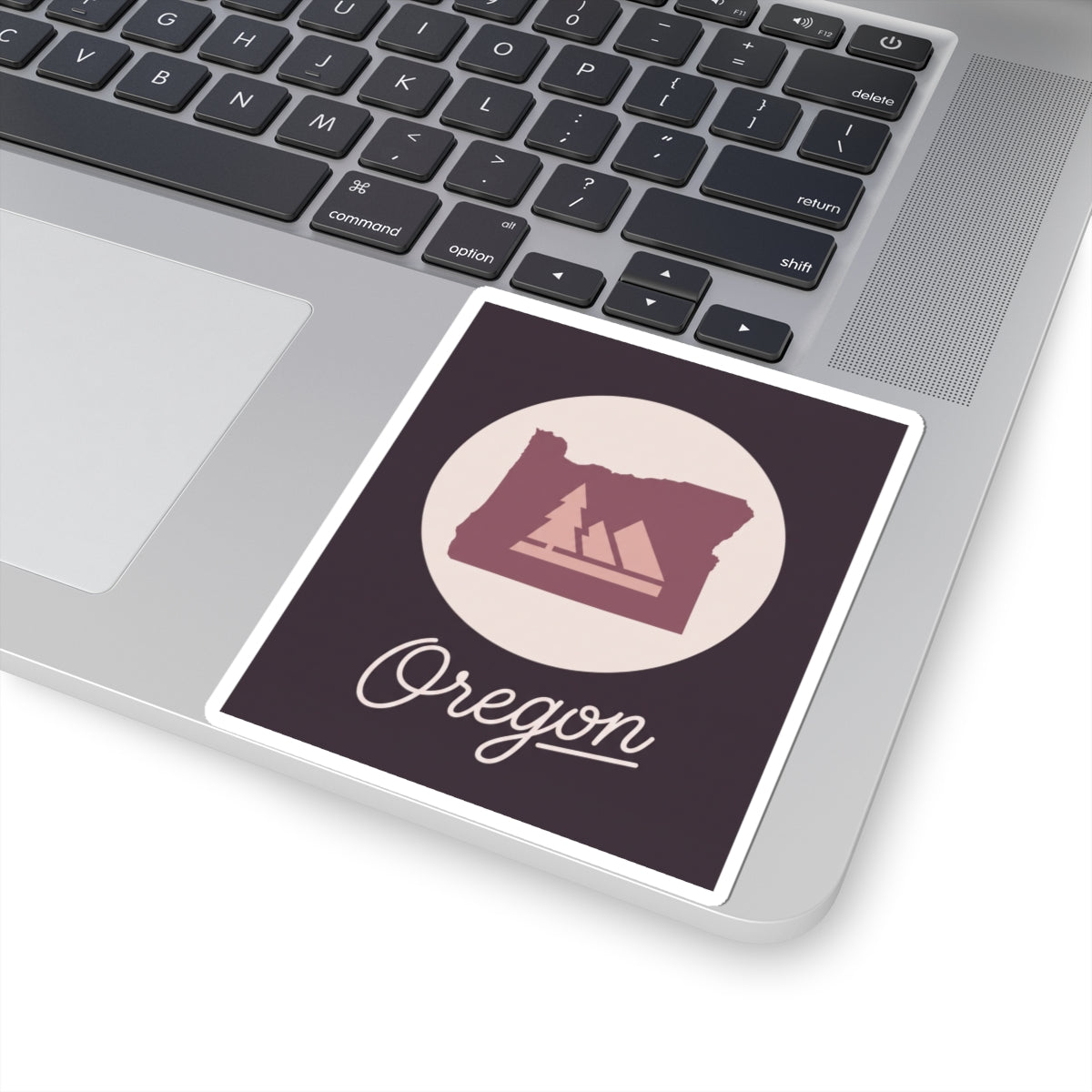 Square kiss-cut decal sticker featuring circular Oregon silhouette and cursive “Oregon”