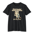 Black t-shirt with cartoon opossum holding a coffee cup graphic and slogan