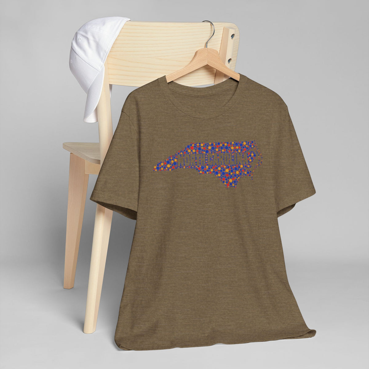 Olive-brown T-shirt with colorful dotted North Carolina outline graphic