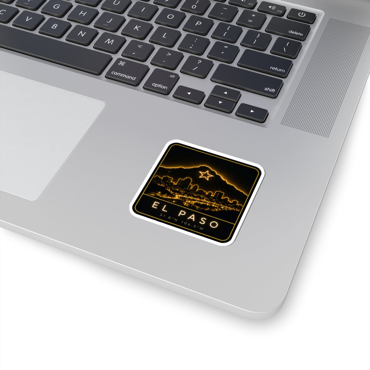 Square kiss-cut sticker with neon El Paso skyline and mountain star on laptop