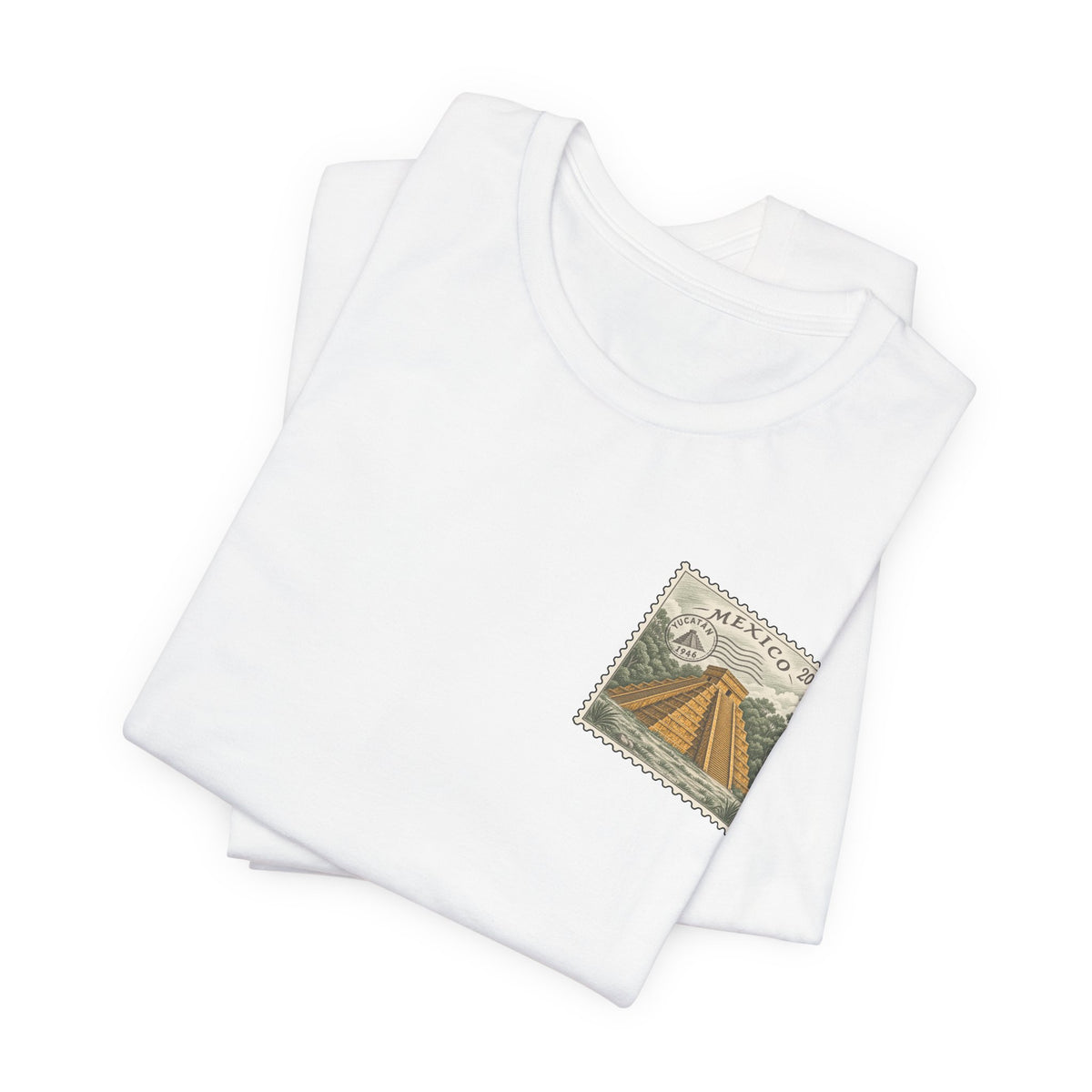 White crew-neck t-shirt set with small vintage Mexico postage-stamp graphic on chest.