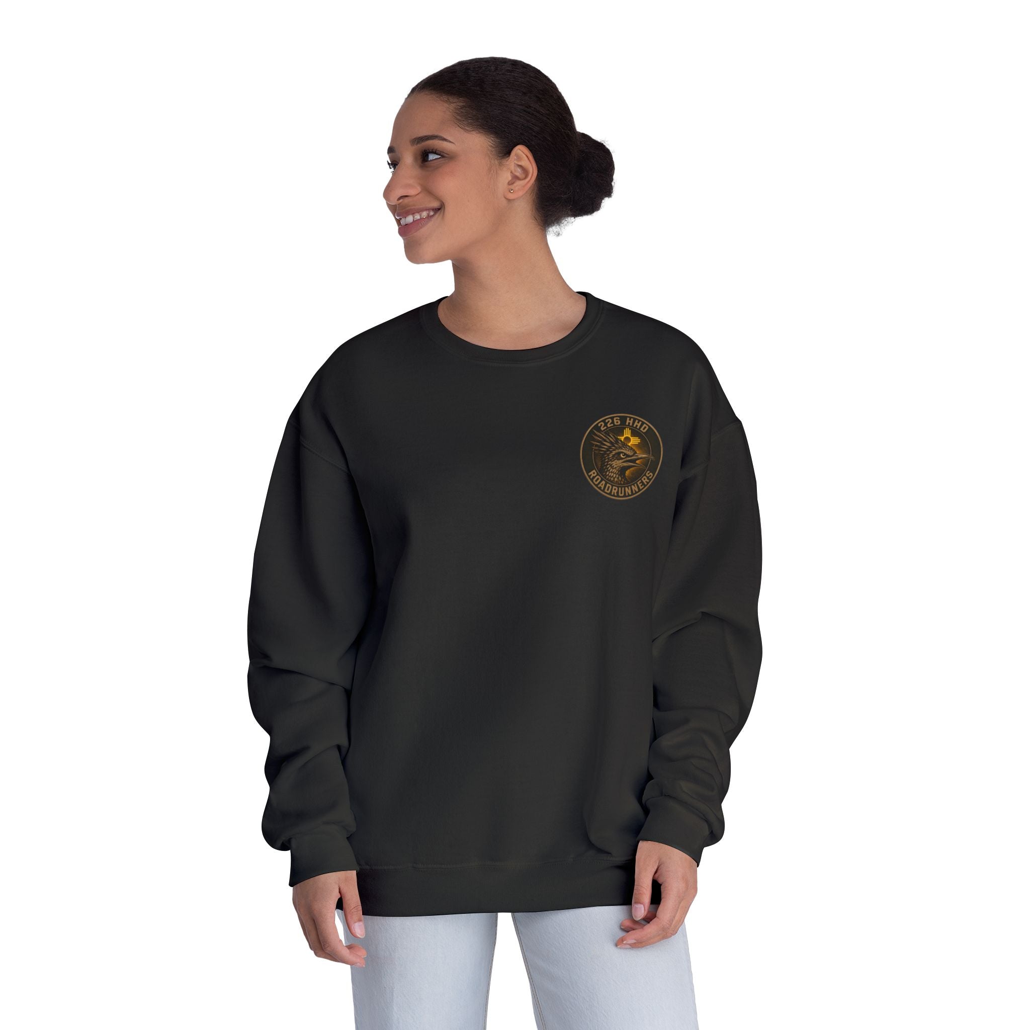 Black crewneck sweatshirt on model, side view with front patch emblem