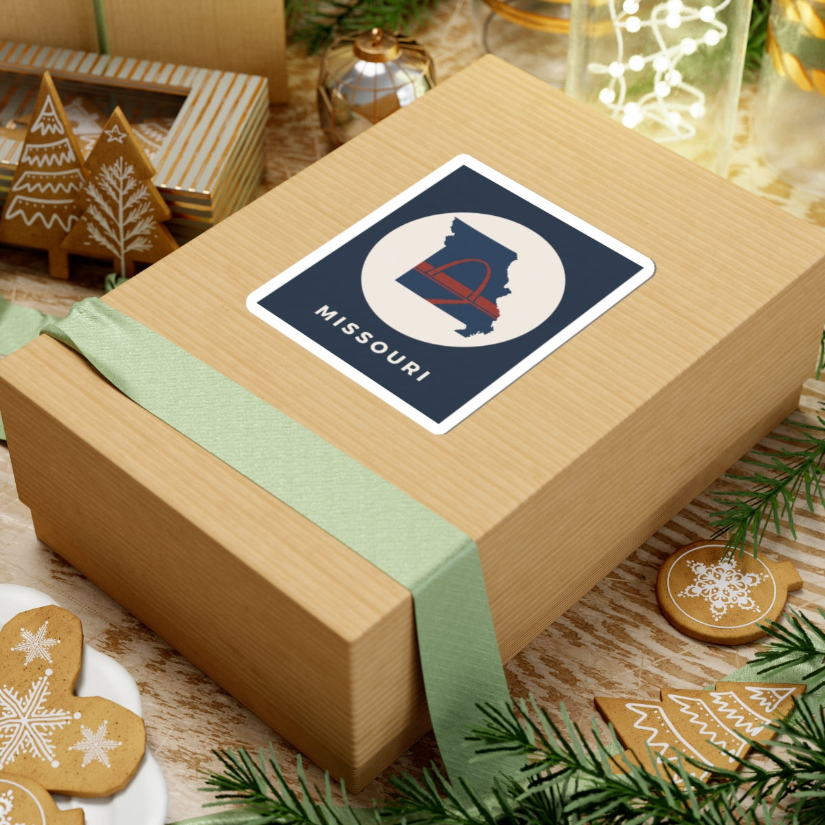 Missouri state map arch sticker with cream circle and MISSOURI text on a gift box