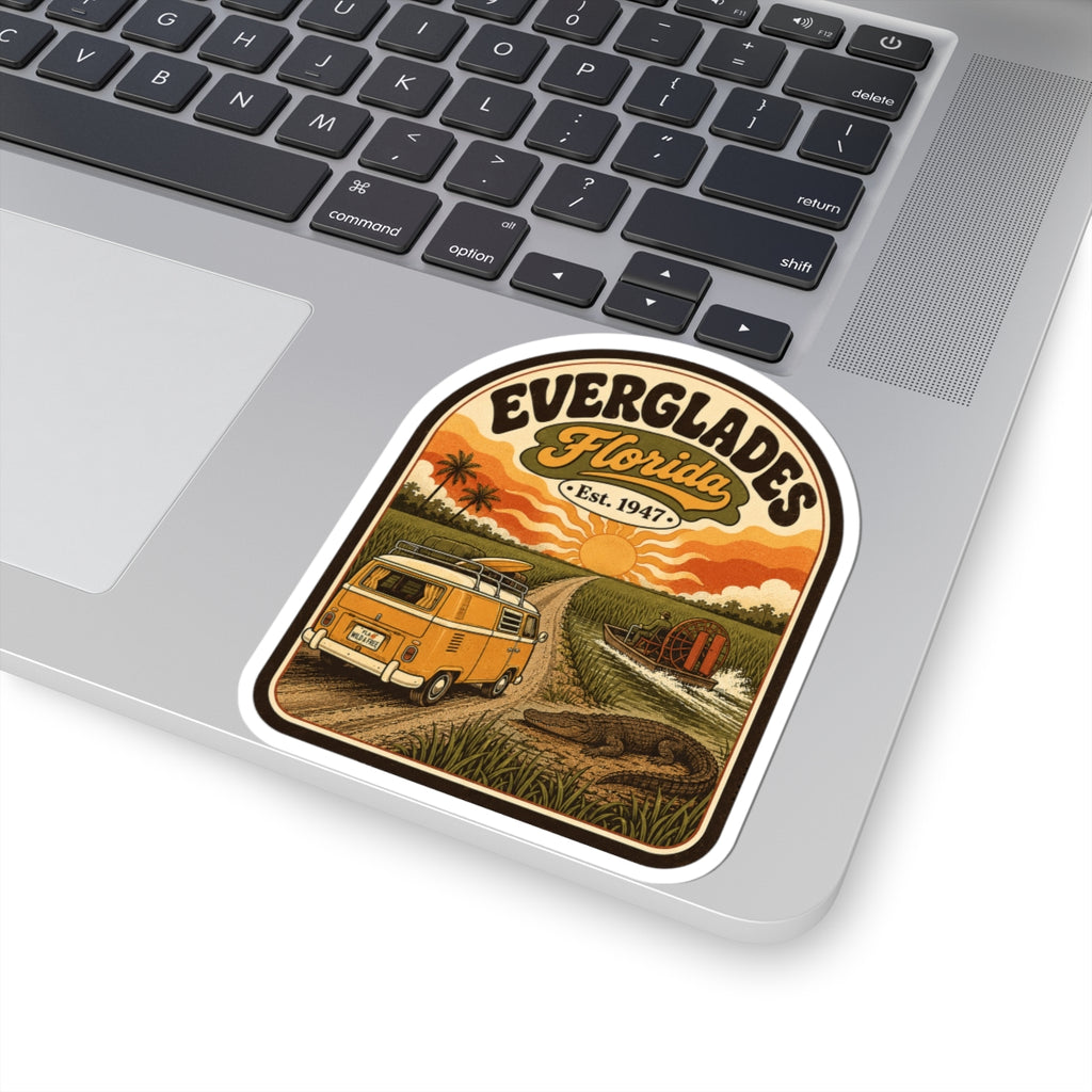 Everglades Florida vintage camper sticker on silver laptop, orange van sunset illustration