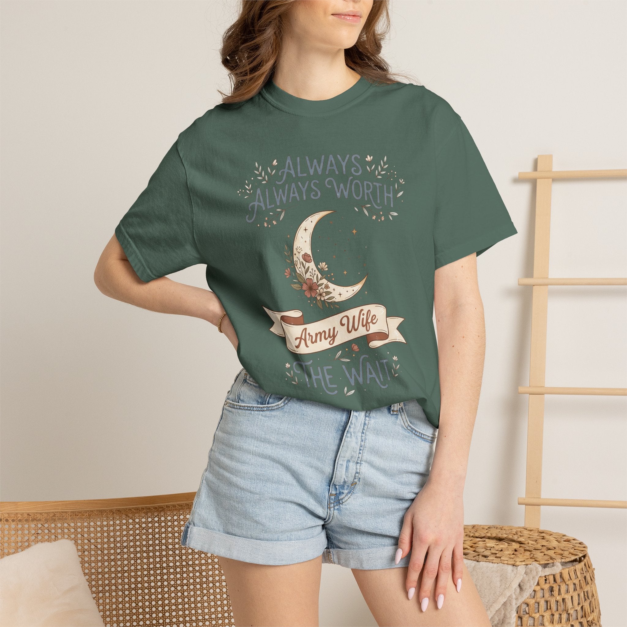 T-shirt in deep green with moon and “ALWAYS WORTH THE WAIT” graphic, worn by model.