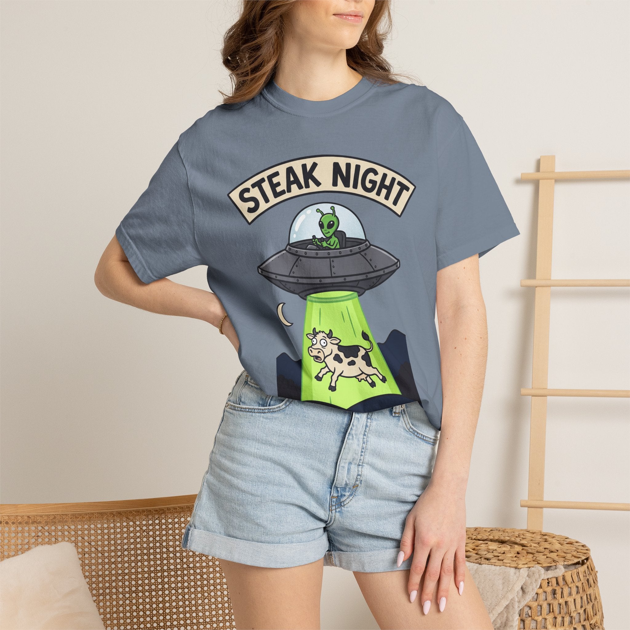 Slate blue short-sleeve T-shirt with 'STEAK NIGHT' UFO and cow-in-green graphic