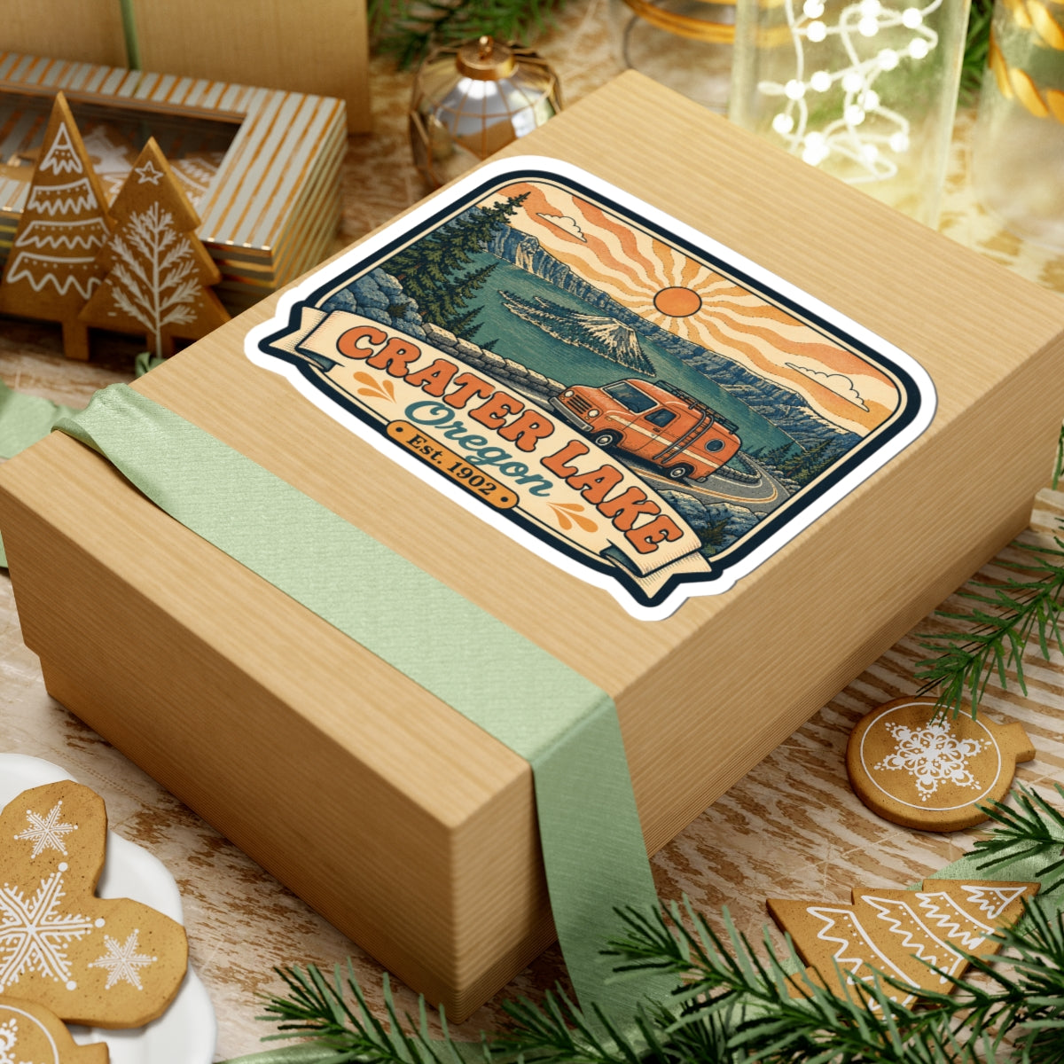 Kiss-cut decal sticker featuring Crater Lake Oregon text and orange camper van on a gift box