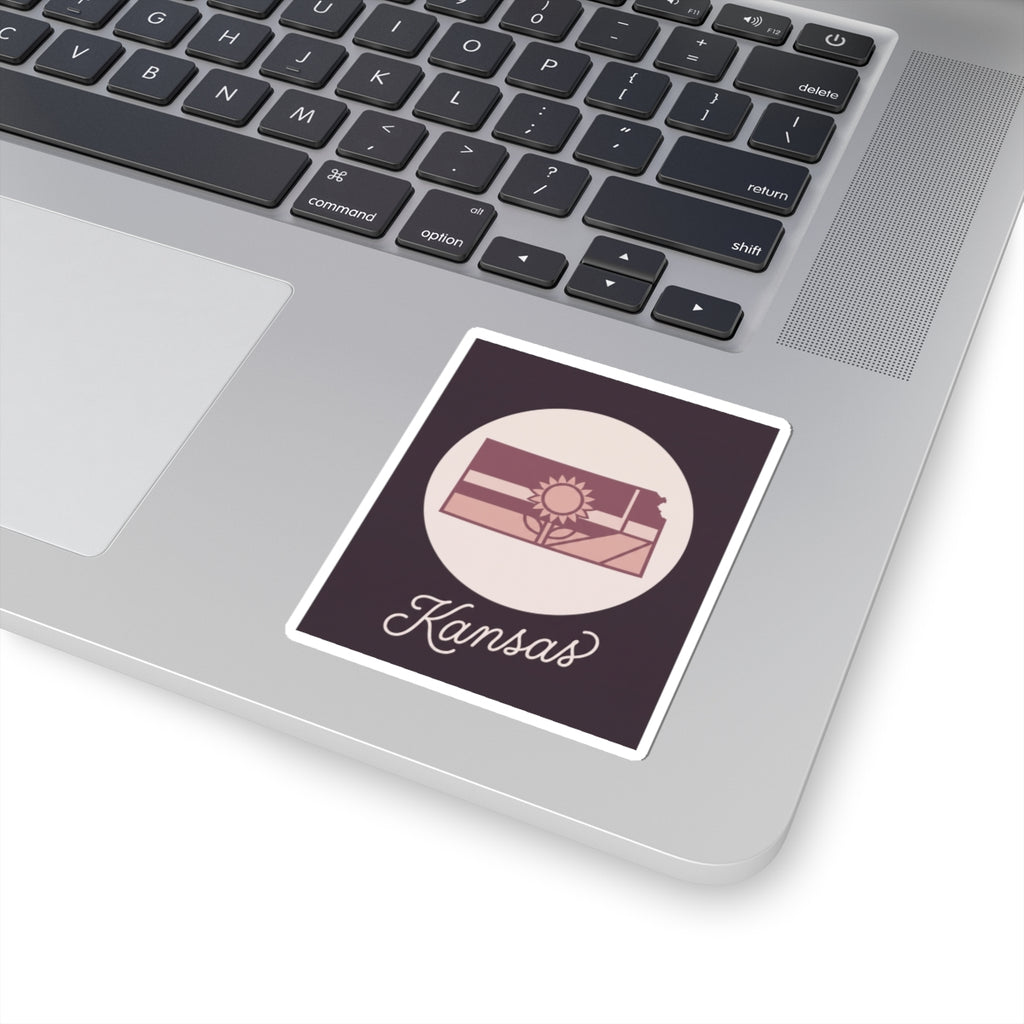 Kansas mauve kiss-cut vinyl decal sticker with state silhouette, sun icon, and “Kansas” script