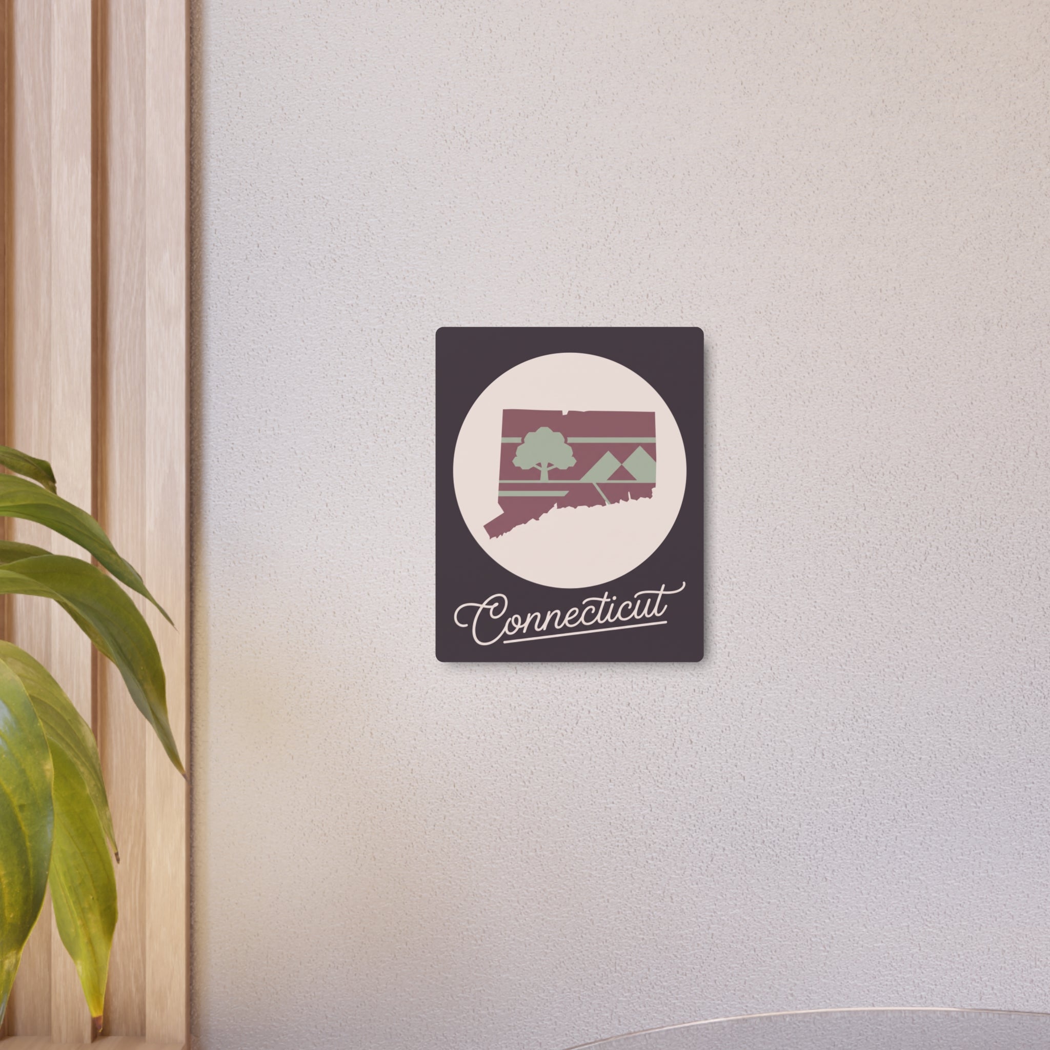 Small Connecticut metal wall art: dark square panel with oval mauve & sage state silhouette