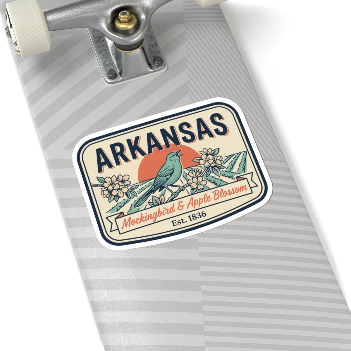 Arkansas vintage badge sticker on a gray striped surface, blue bird and apple blossoms