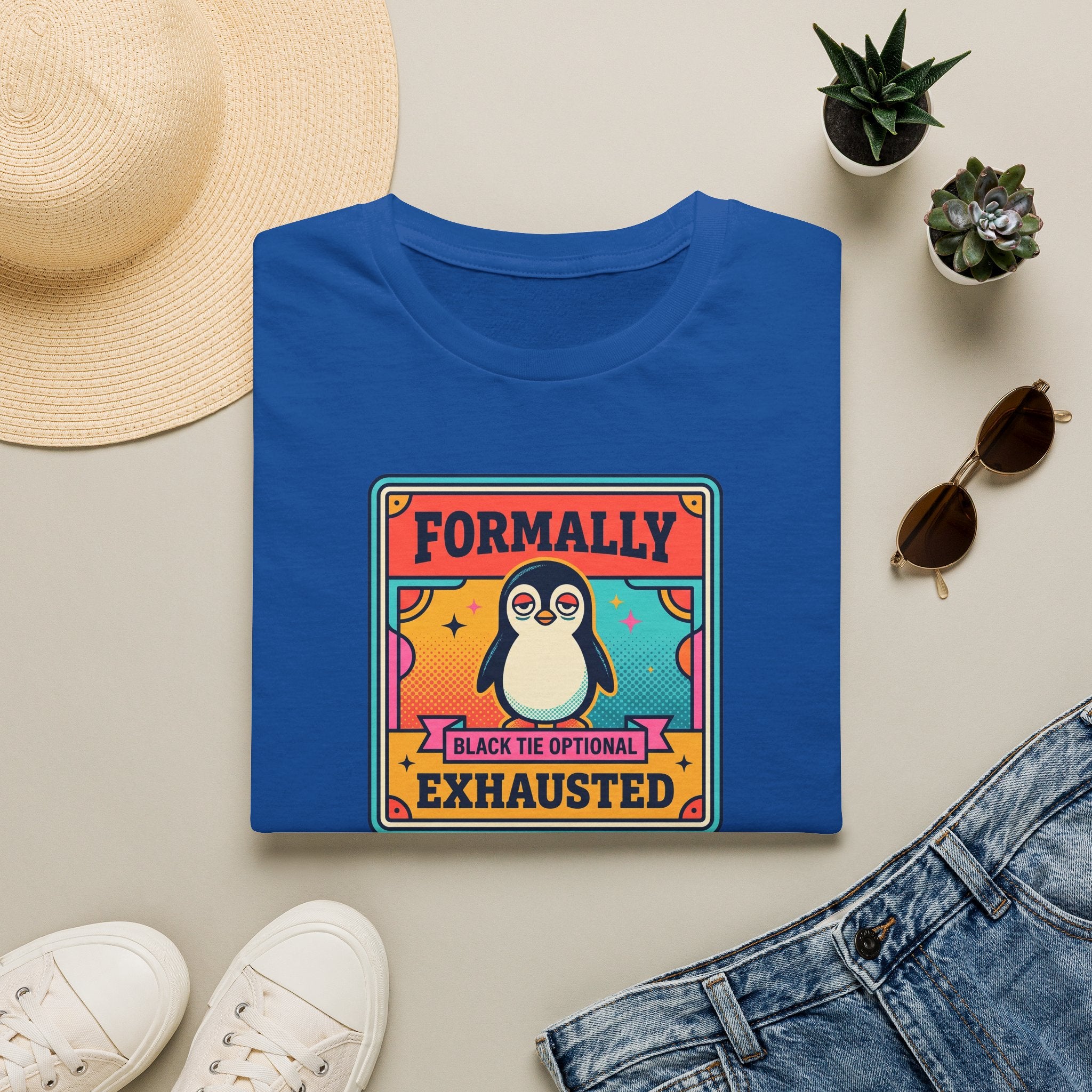 Royal blue crew-neck T-shirt with retro penguin badge graphic and “Formally” “Exhausted” text.