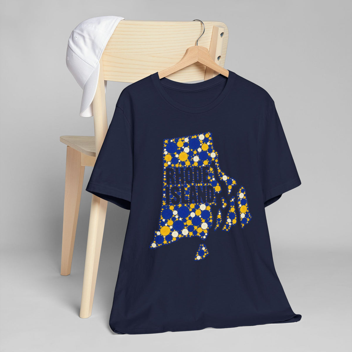Navy t-shirt with dotted Rhode Island outline graphic in blue and yellow