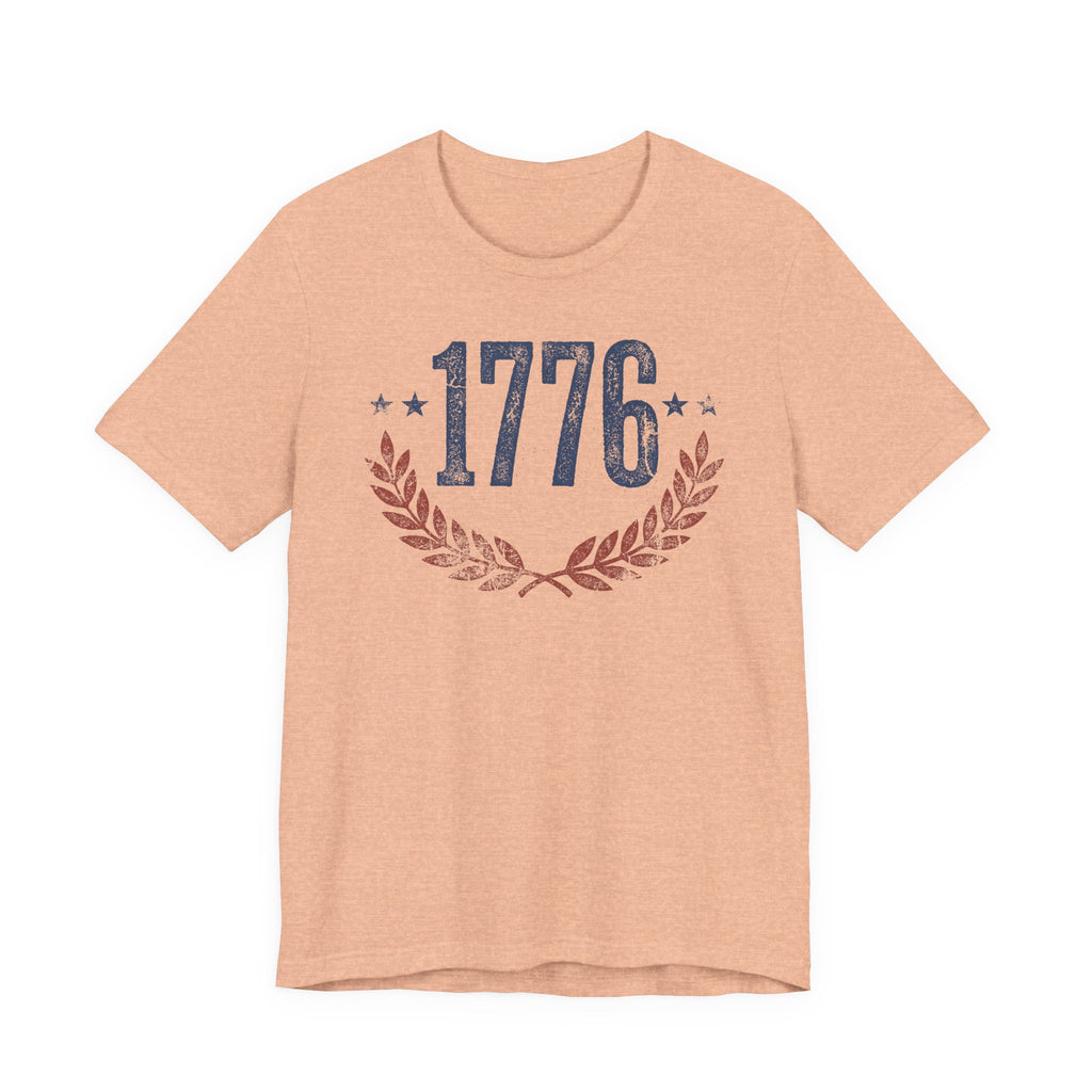 Heather Peach T-shirt with '1776' laurel wreath graphic and star accents