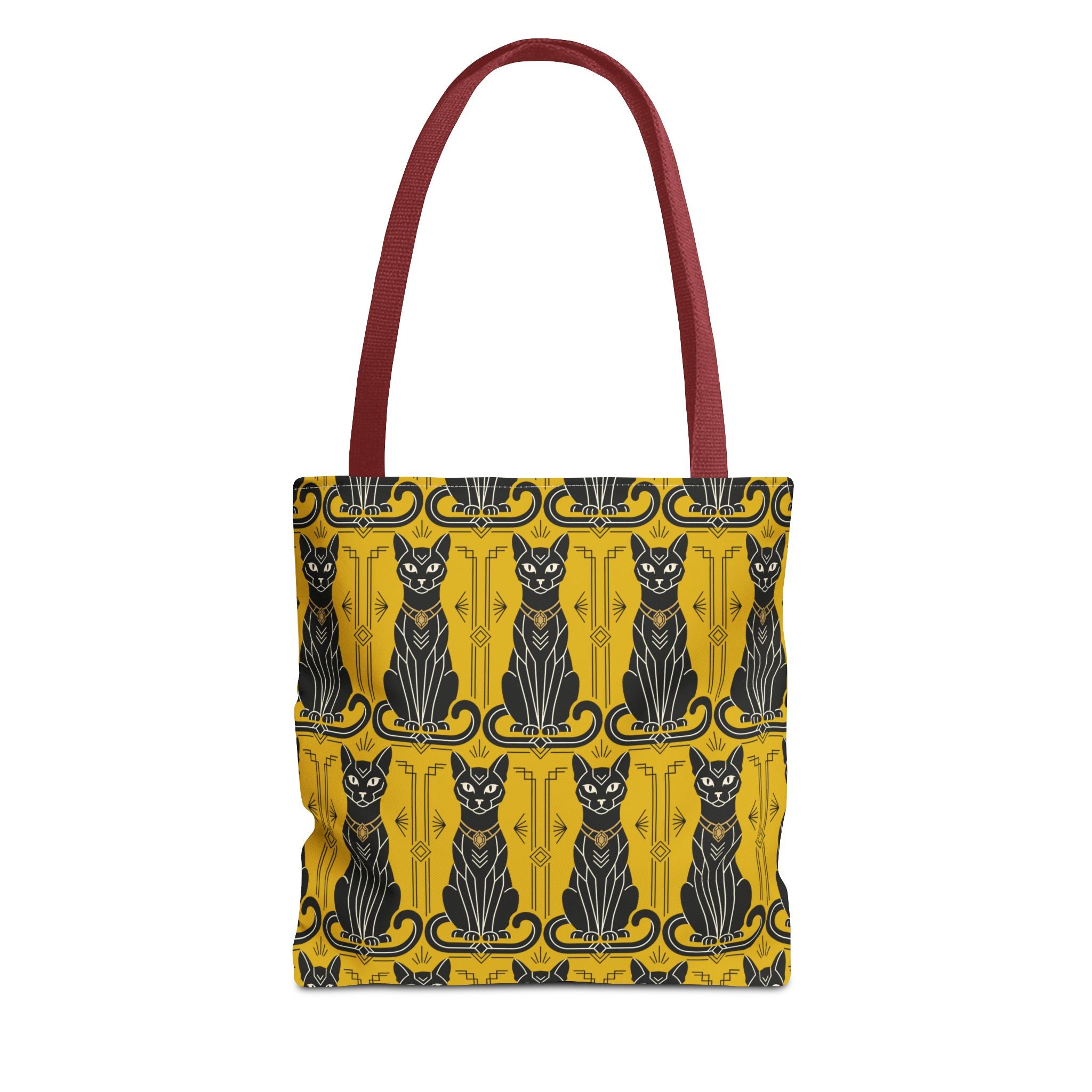 Tote bag with yellow cat print, blue-and-black cat faces, burgundy top handles.