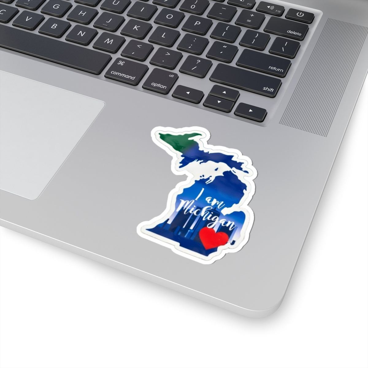 Die-cut Michigan 'I am Michigan' sticker with red heart on laptop