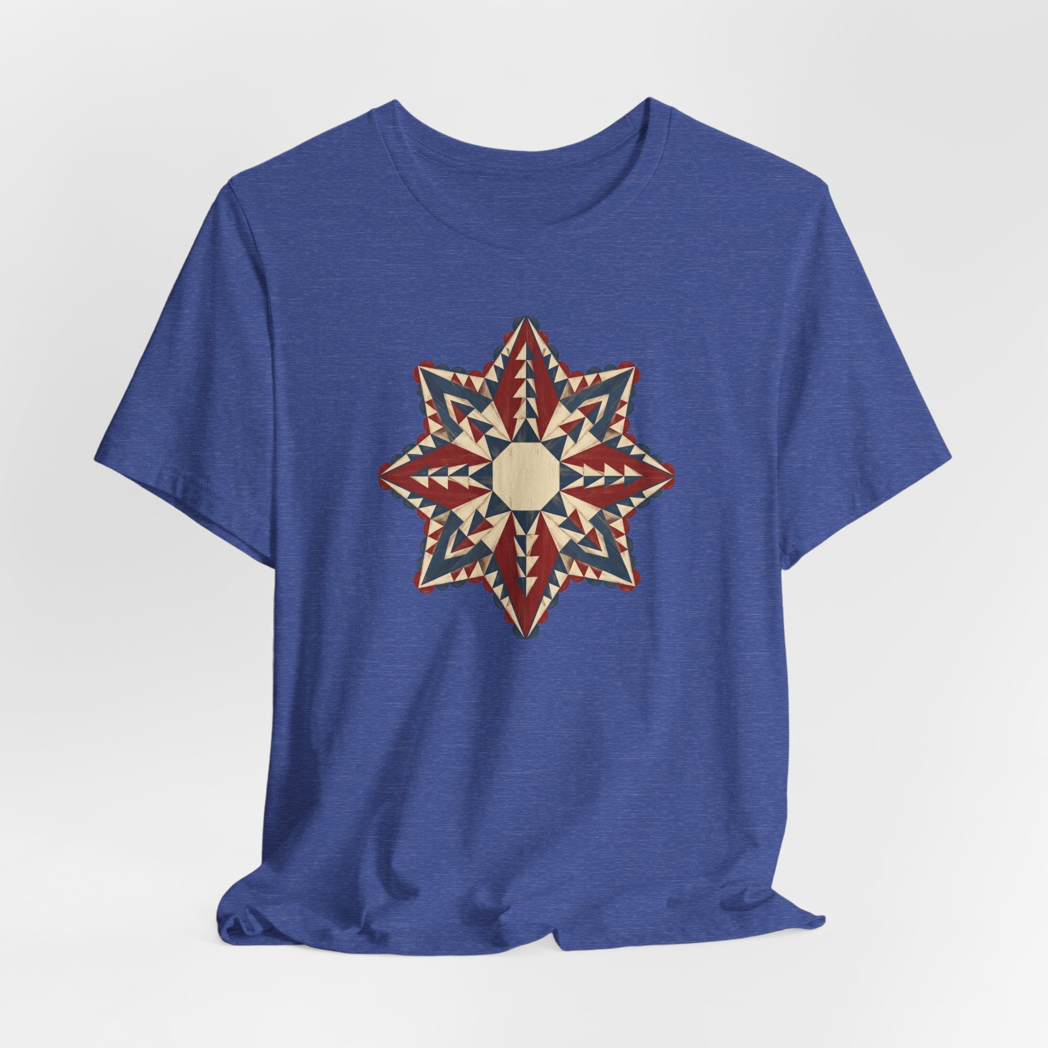 Blue crewneck T-shirt with center star mandala graphic in red, cream, and tan
