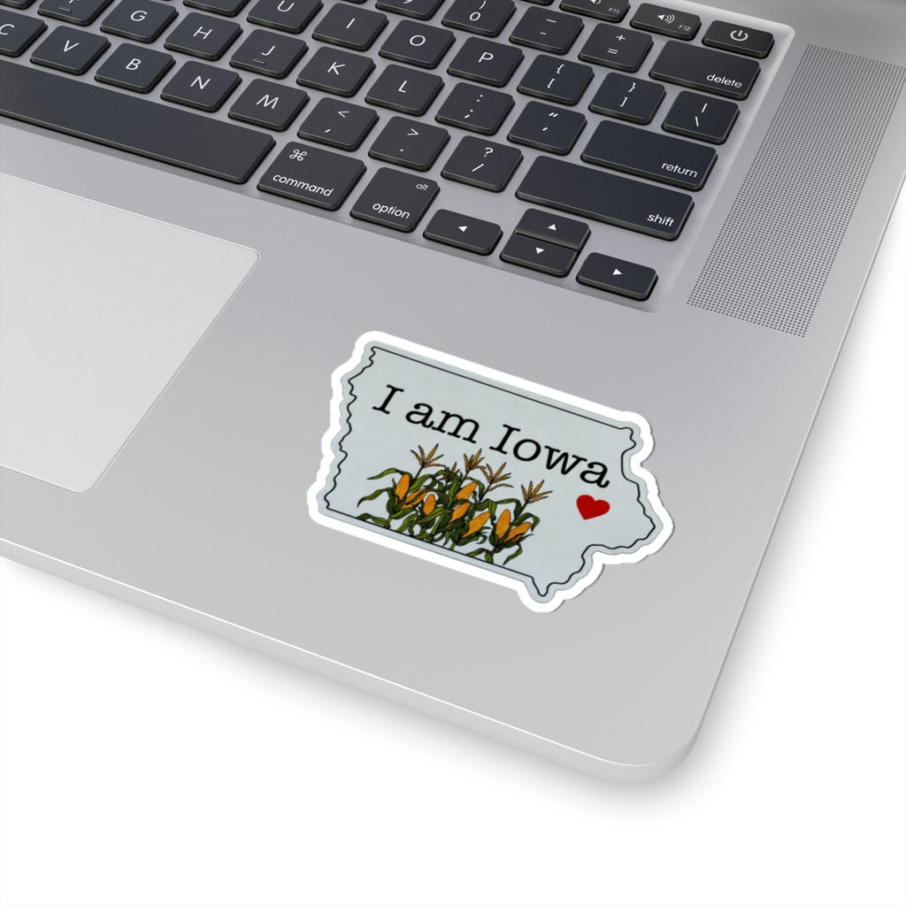 I Am Iowa sticker on laptop, white outline, corn plants and red heart