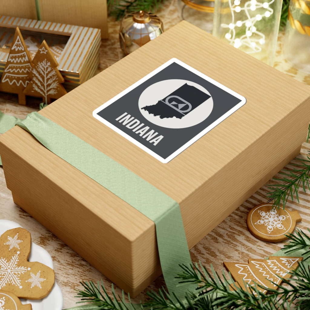 Indiana sticker on gift wrap, black-and-white badge emblem with “INDIANA” text