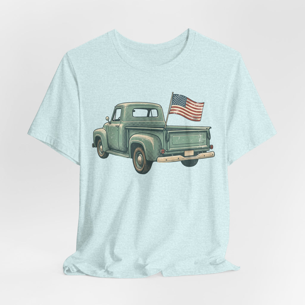 Light blue crewneck t-shirt with green pickup truck and American flag on chest