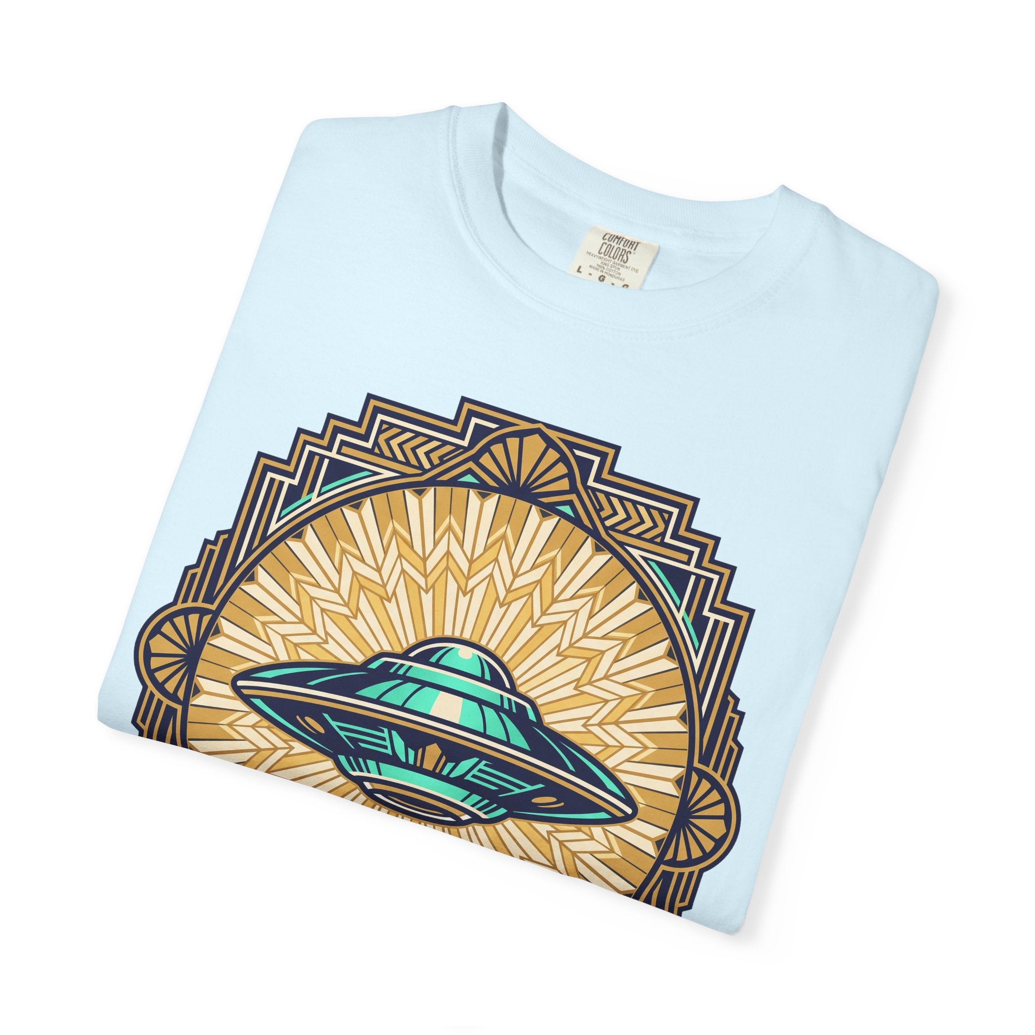 Light blue crew-neck T-shirt with a retro UFO graphic and geometric sunburst frame.