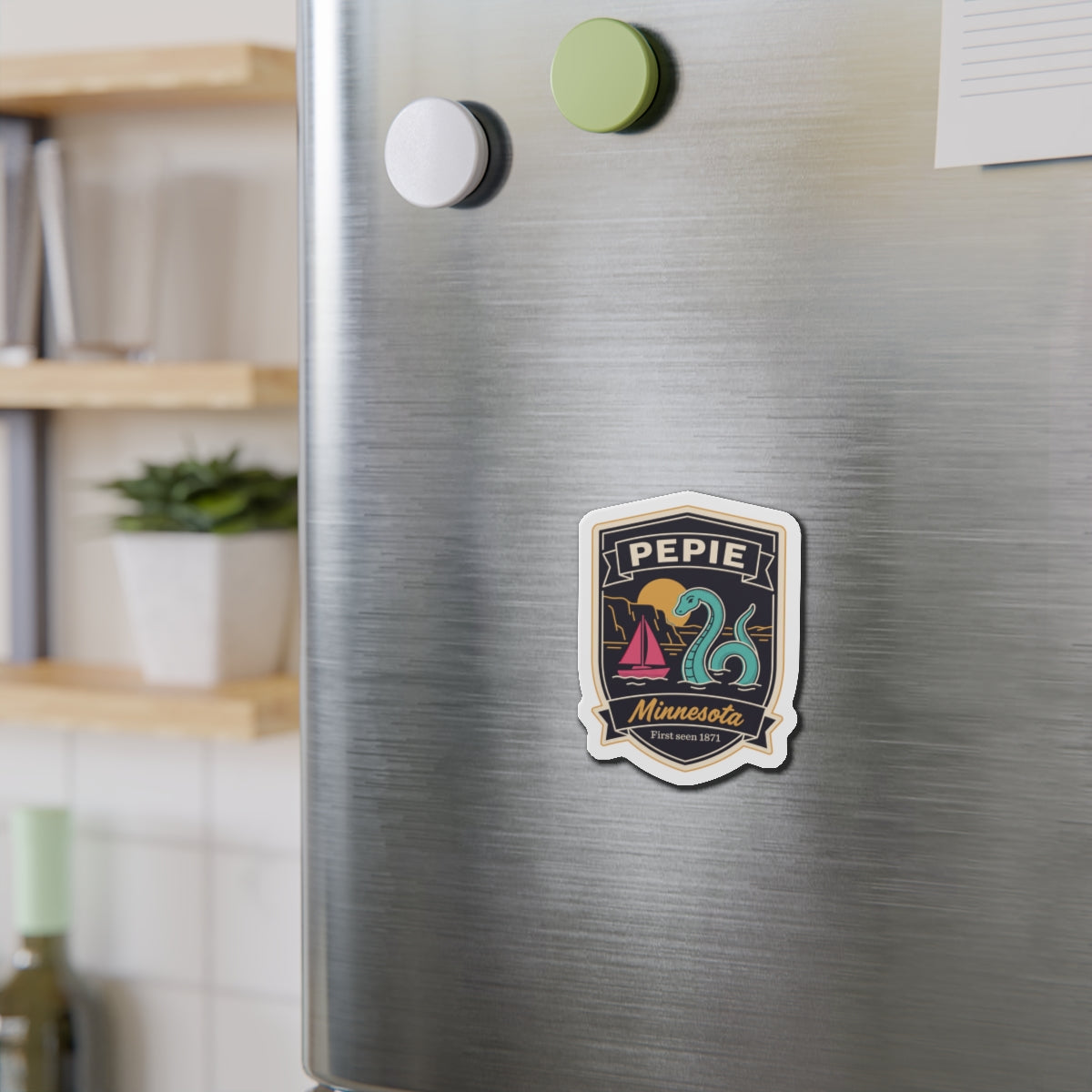 Die-cut shield magnet on stainless refrigerator door, multicolor Pepie Minnesota emblem