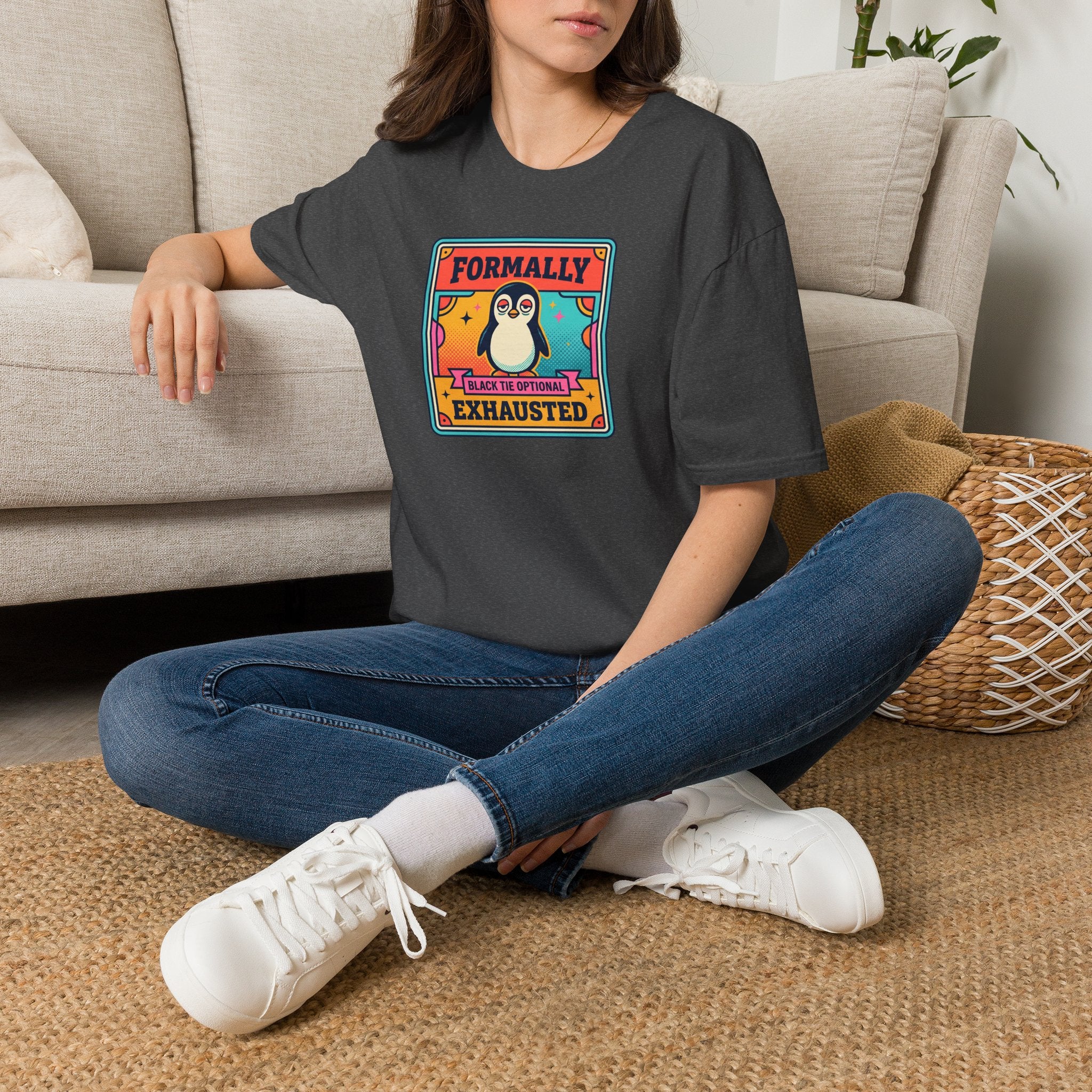 Charcoal crew-neck T-shirt with colorful penguin “Formally Exhausted” graphic.