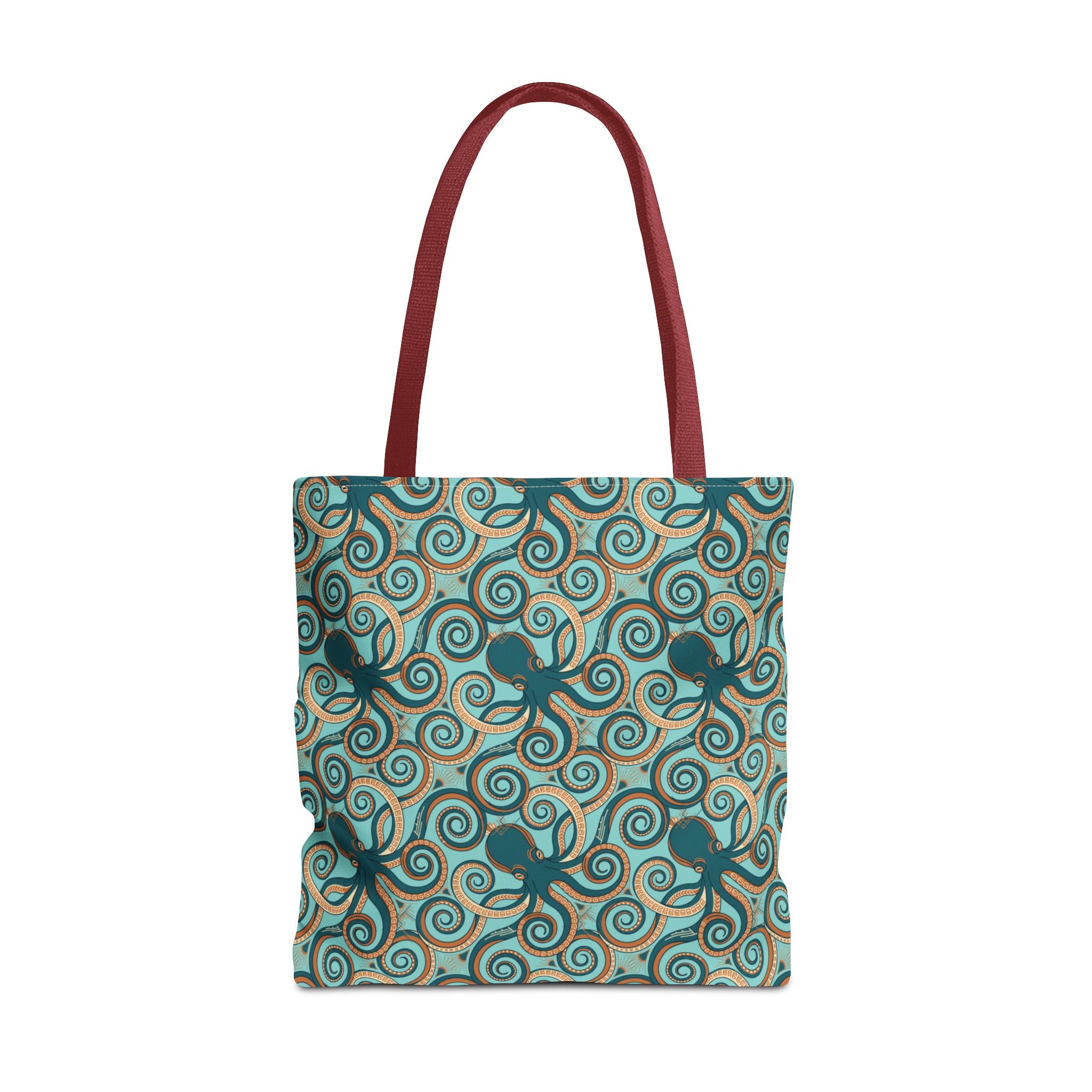Teal tote bag with all-over octopus swirl pattern and red handles