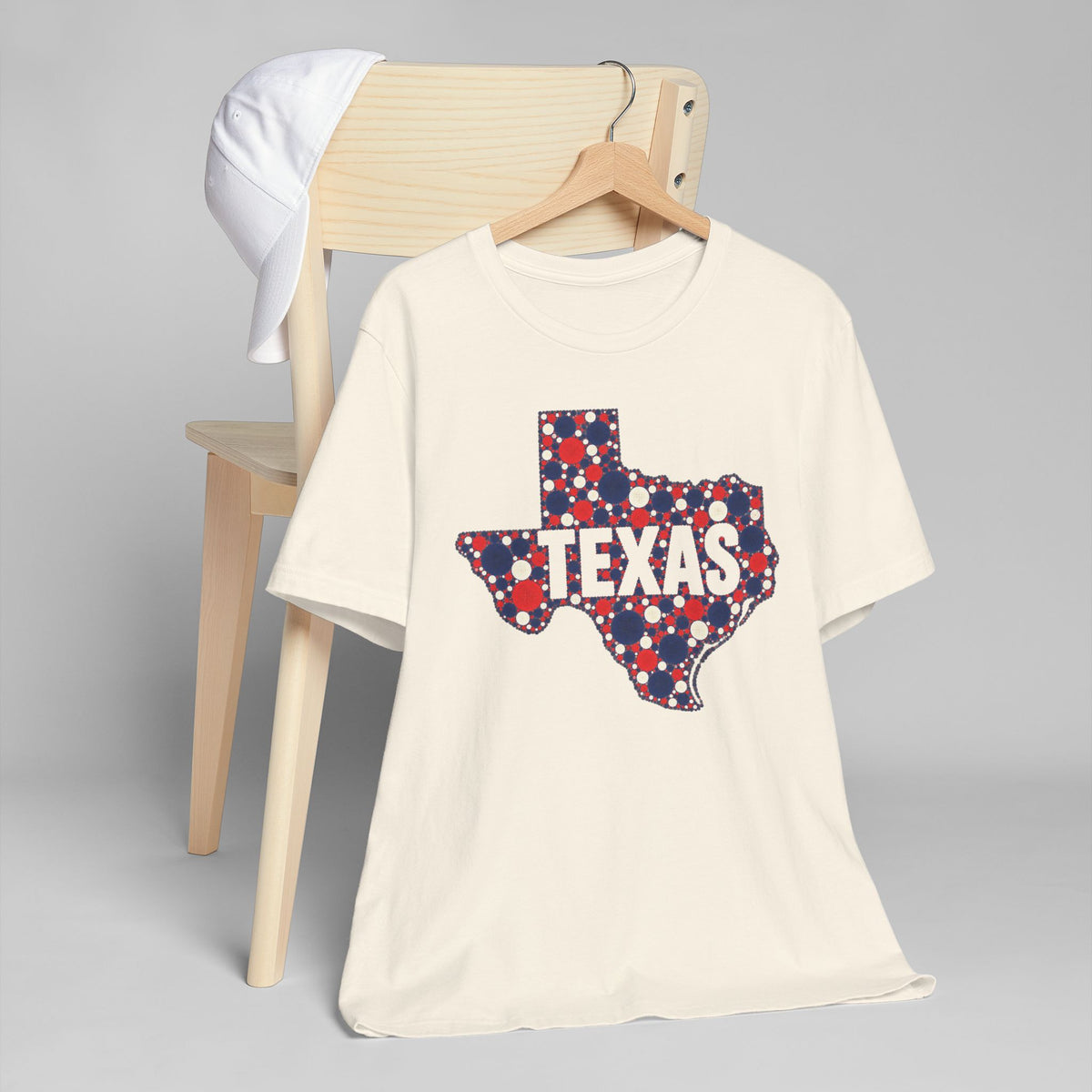 Cream crewneck T-shirt with patriotic polka-dot Texas outline graphic on front