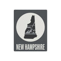 Metal wall art sign with New Hampshire silhouette and "NEW HAMPSHIRE" text