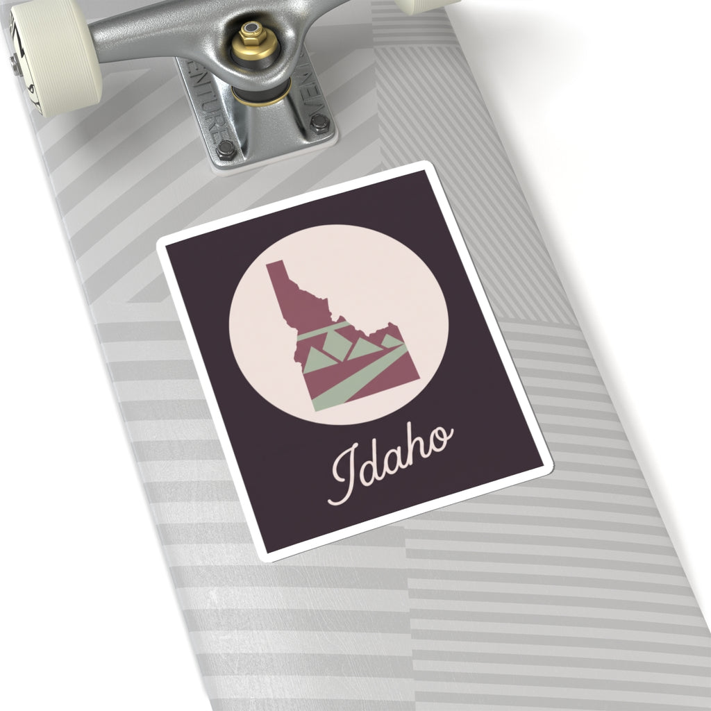 Idaho silhouette decal on a suitcase, mauve square with circle graphic and 'Idaho' text