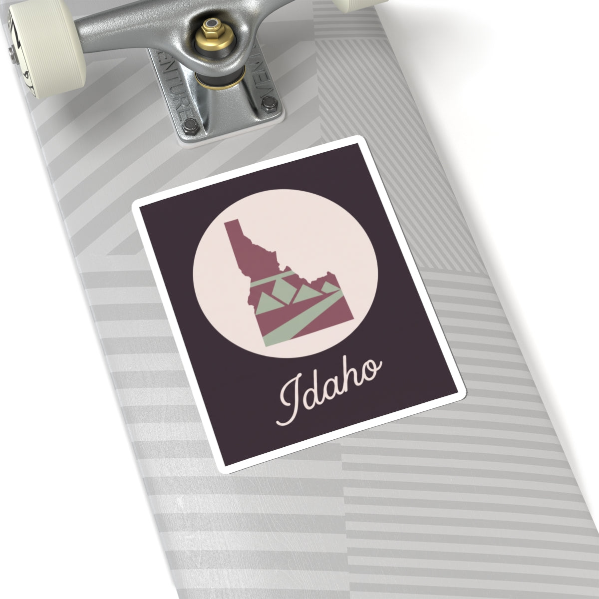 Idaho silhouette decal on a suitcase, mauve square with circle graphic and 'Idaho' text