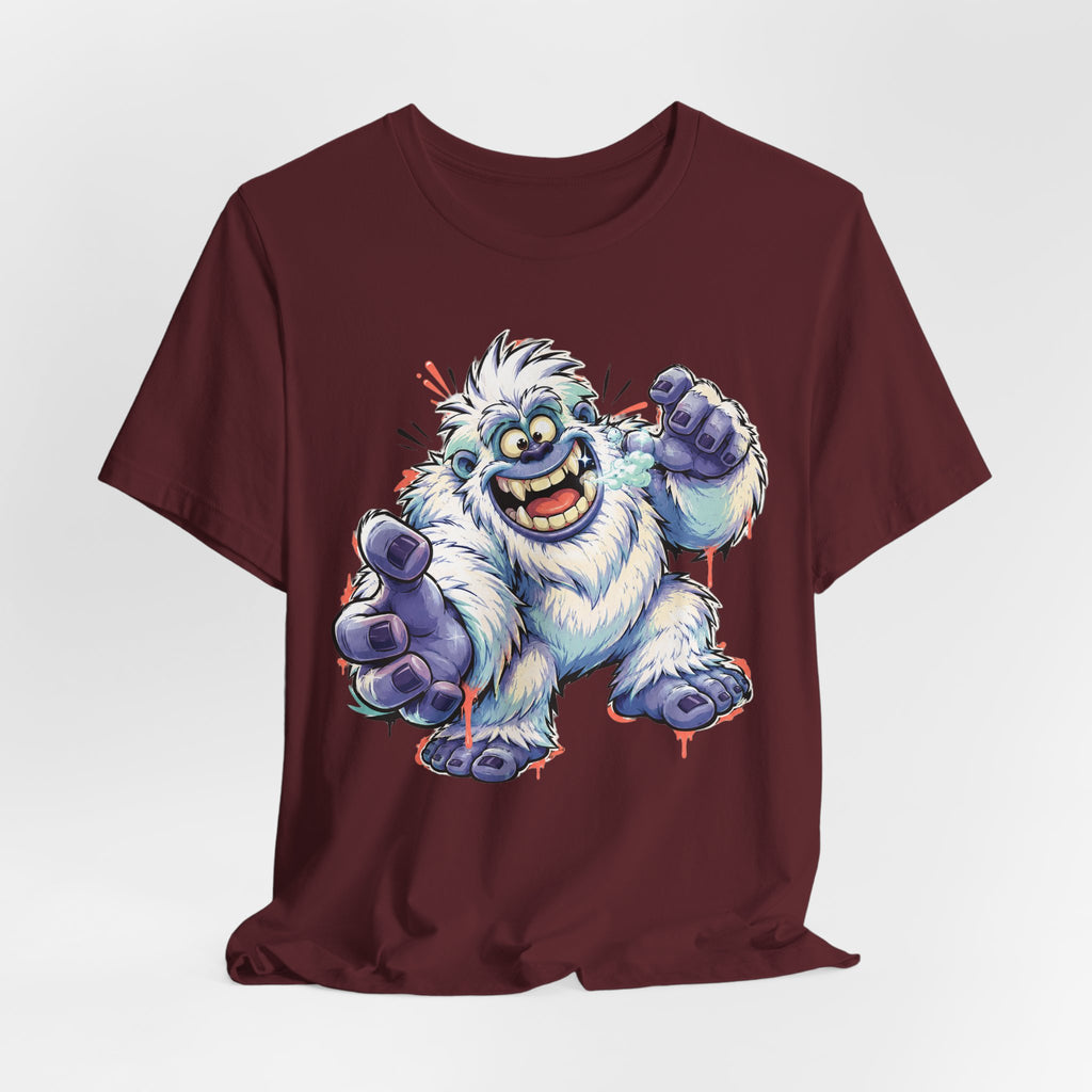 Burgundy crewneck T-shirt with cartoon snow monster illustration and blue raised hands