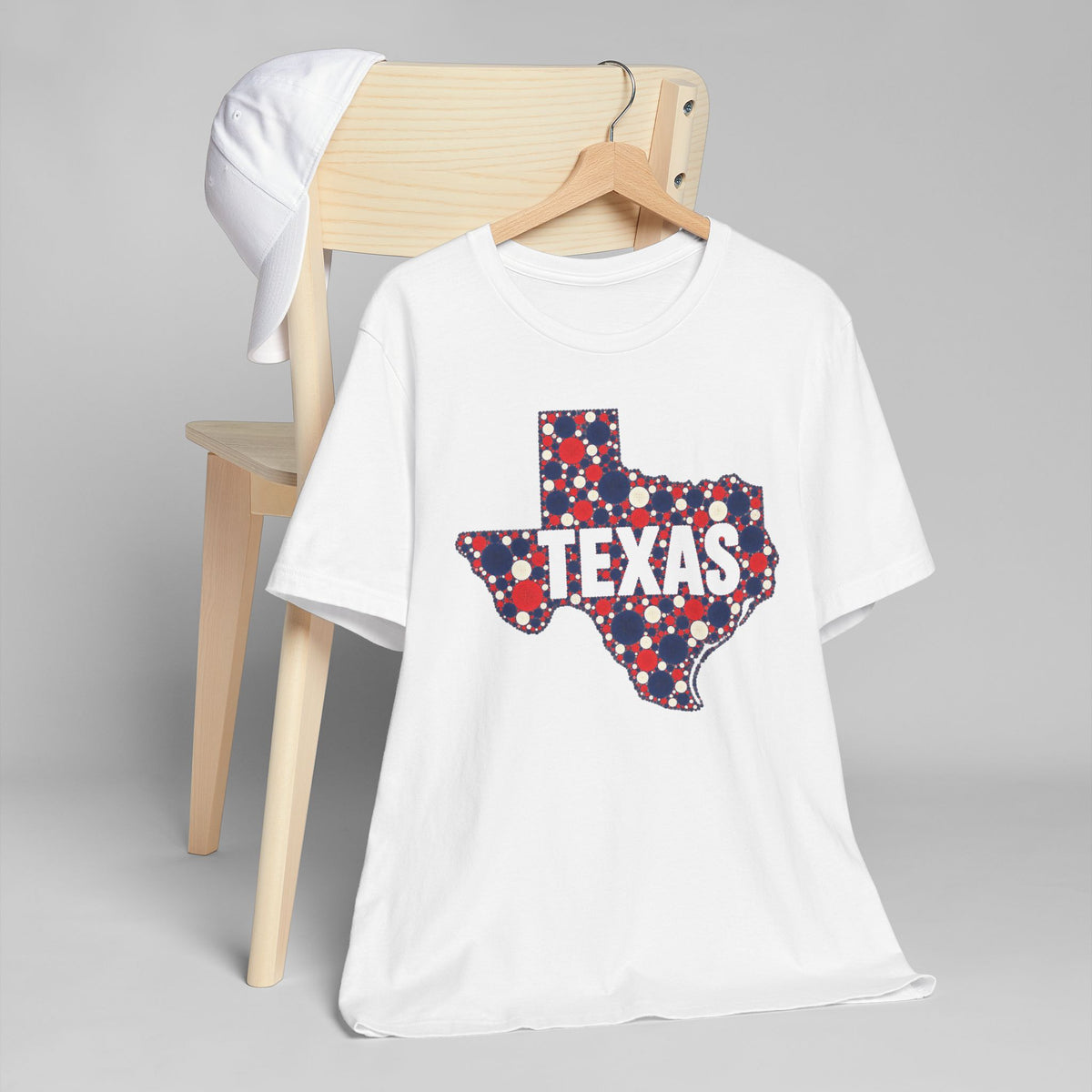 White crewneck T-shirt with patriotic polka-dot Texas outline graphic on front