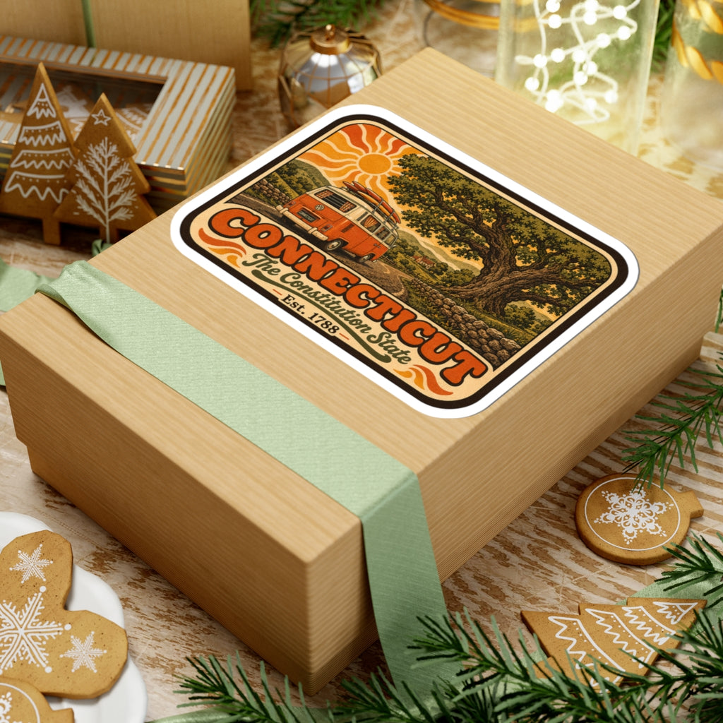 Connecticut vintage camper van sticker on a wrapped gift box with holiday decorations.
