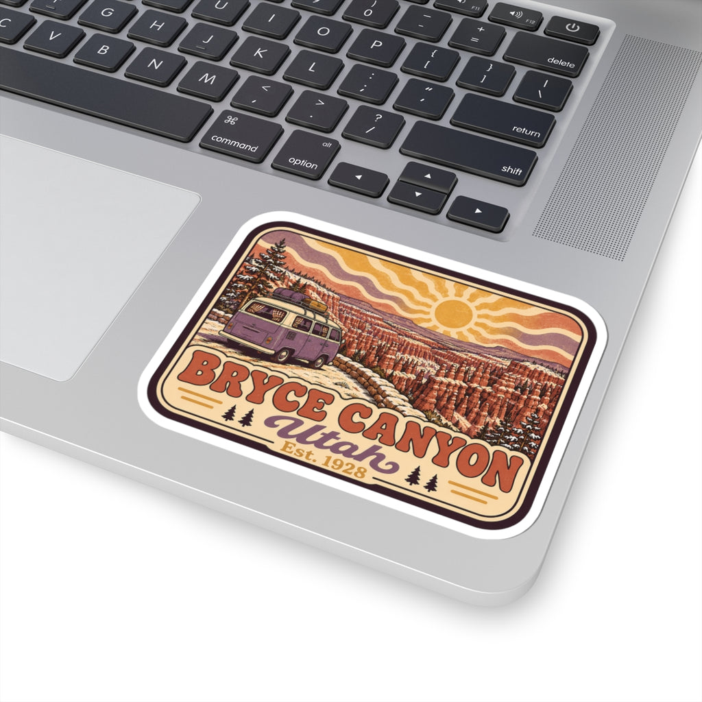 Kiss-cut Bryce Canyon Utah sticker on laptop angled view, with sun and desert canyon