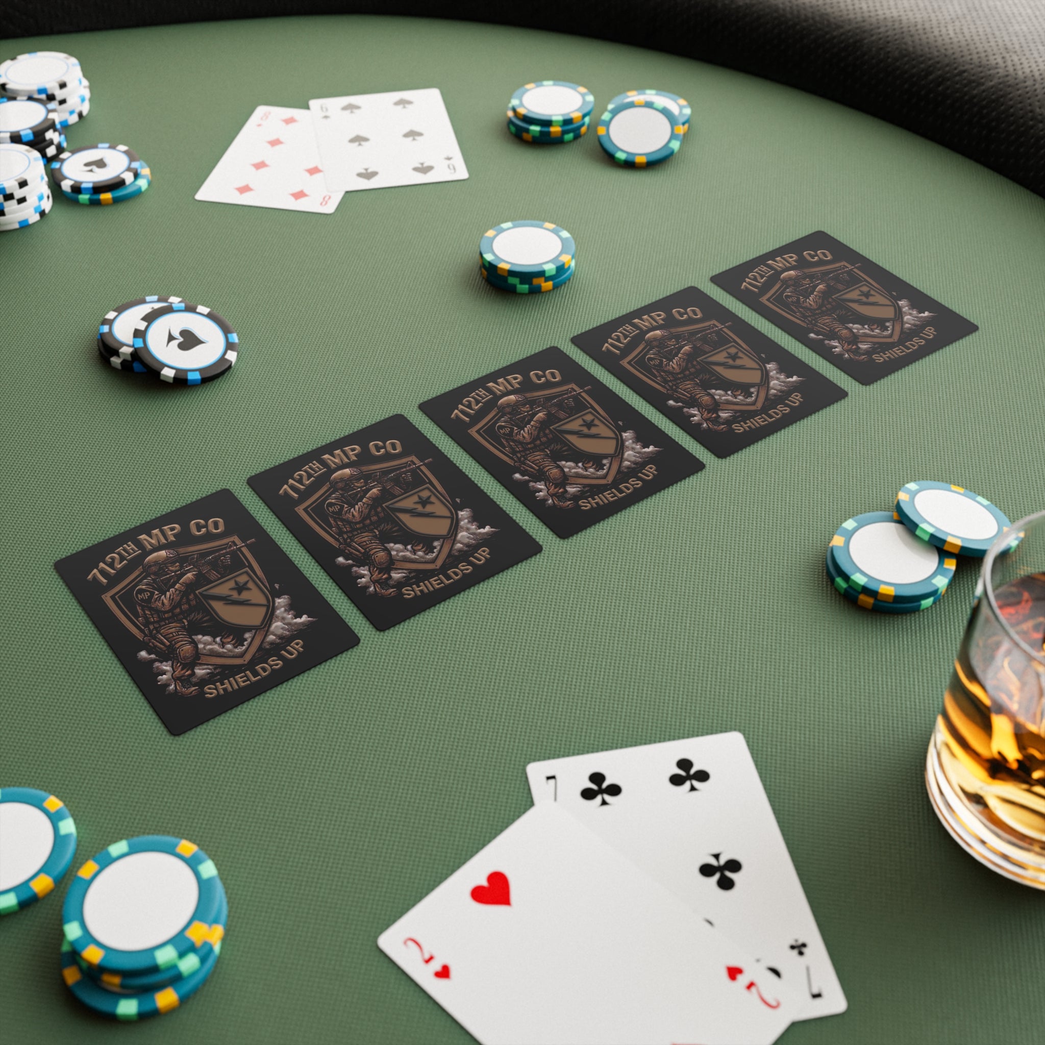 Poker cards laid out, some showing Shields Up artwork and suit pips