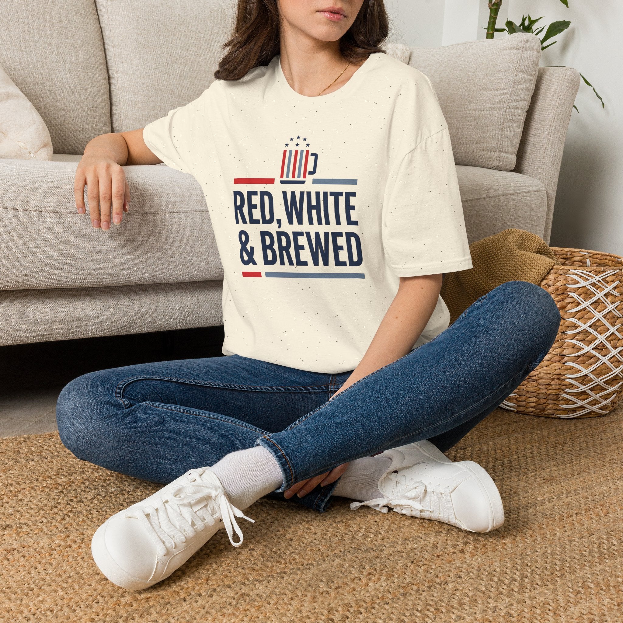 Cream unisex T-shirt with “RED, WHITE & BREWED” logo on the front.