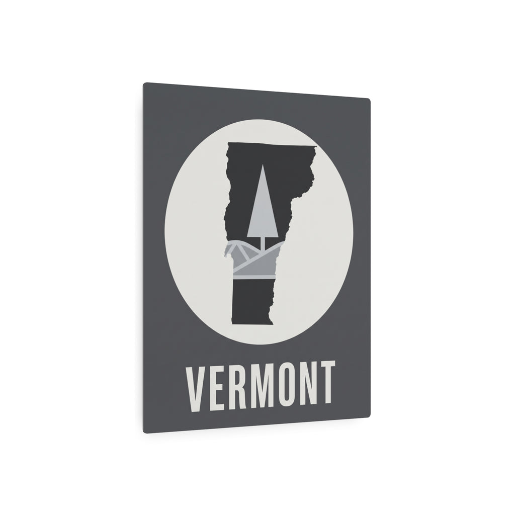Dark gray square Vermont wall art with circular pine-tree silhouette and “VERMONT” text.