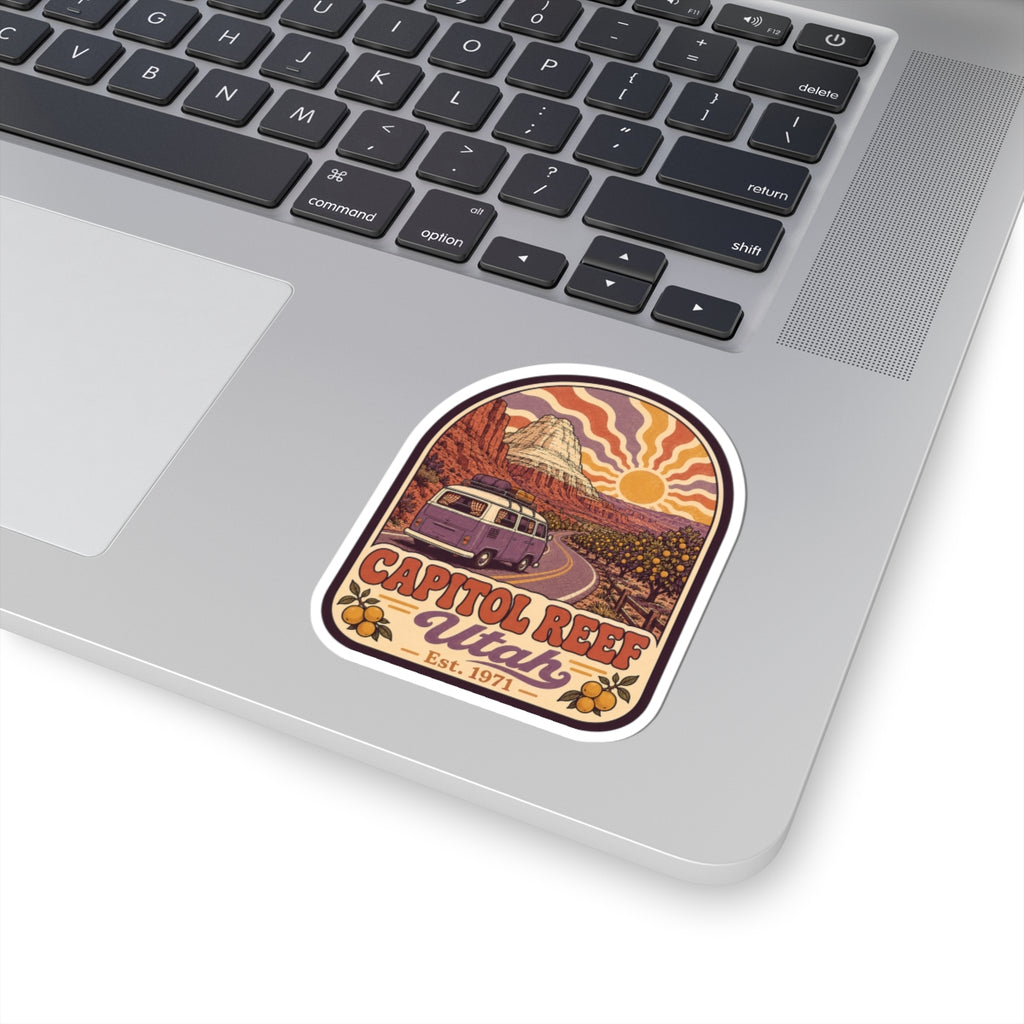 Kiss-cut sticker with camper on desert road, warm sunburst background, and Capitol Reef Utah script.