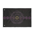 Black moon-phase banner flag with purple circle pattern and gold center mandala, grommets.