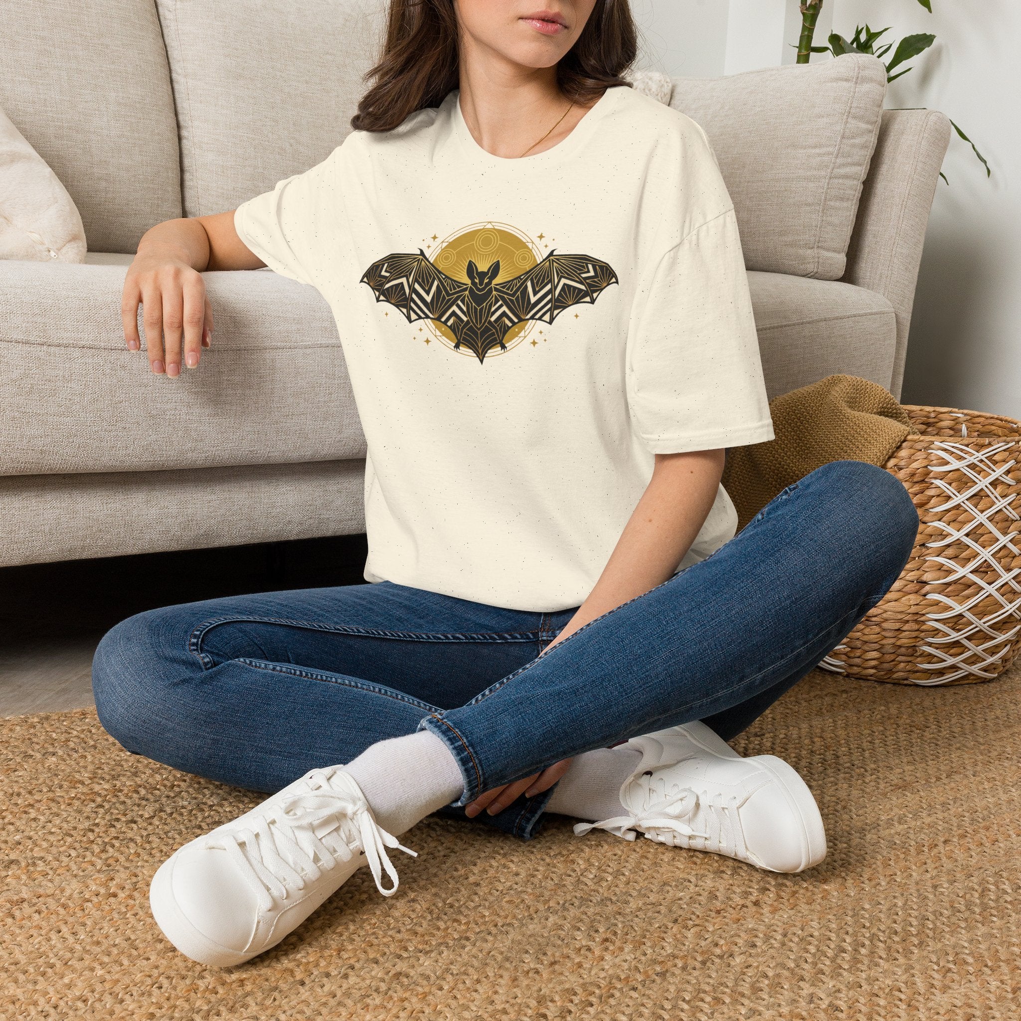 Cream T-shirt with geometric bat graphic on chest, crew neck and short sleeves