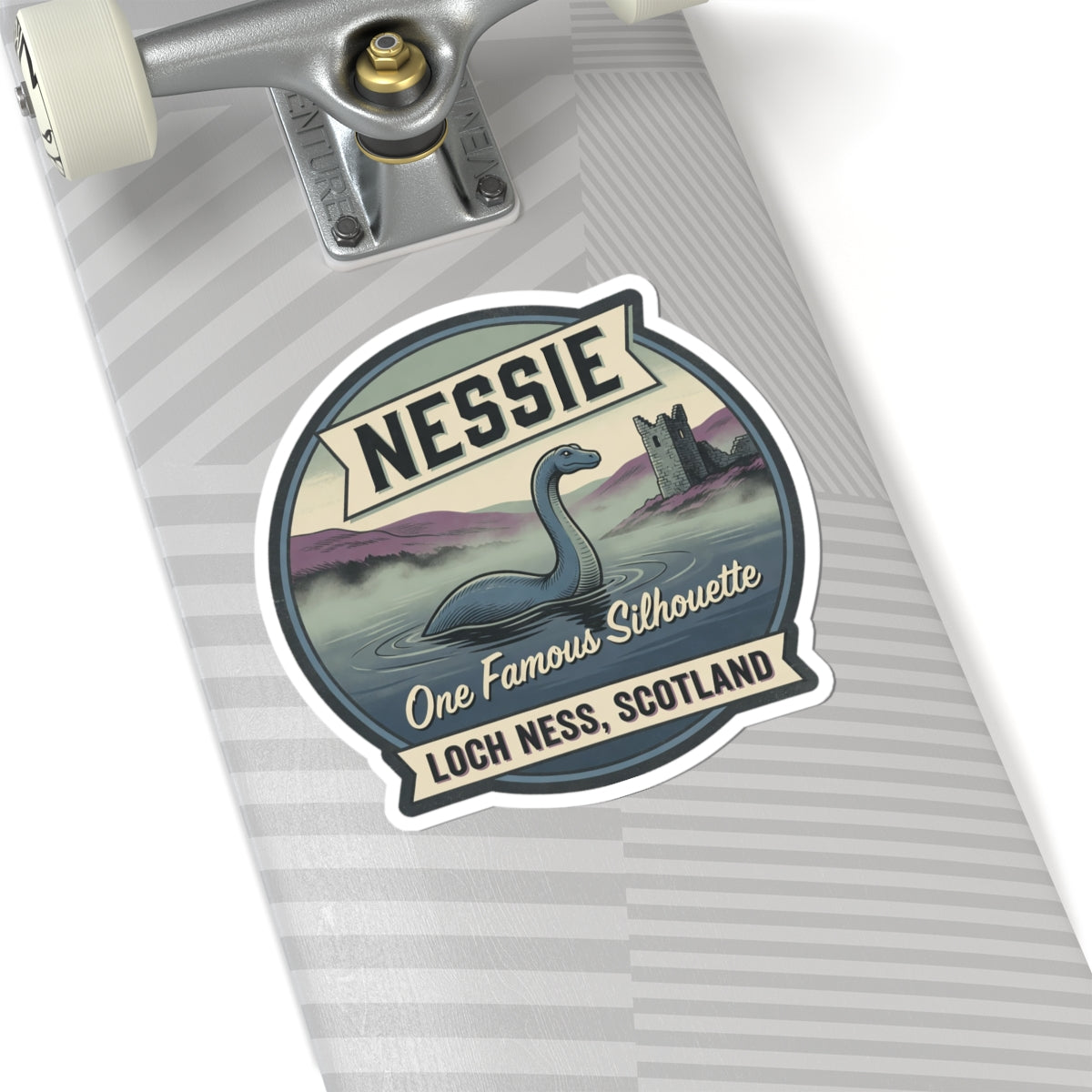 Nessie sticker badge close-up with circular frame and “One Famous Silhouette” and “Loch Ness, Scotland”