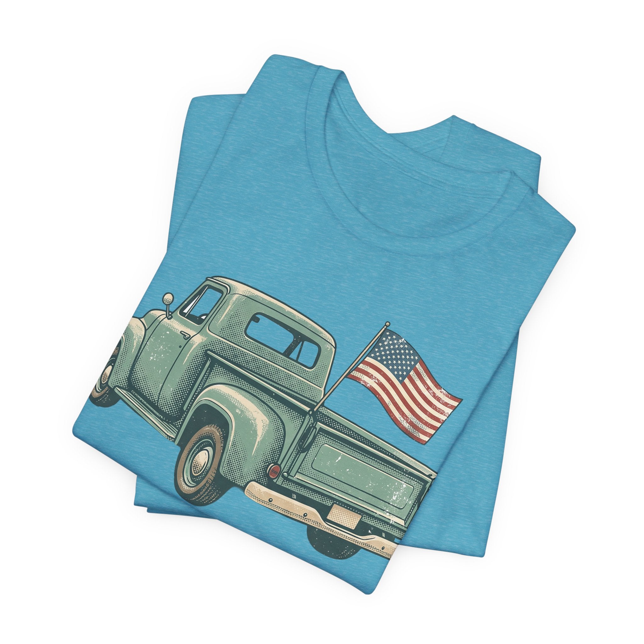 Light blue T-shirt with vintage green pickup truck graphic and American flag.
