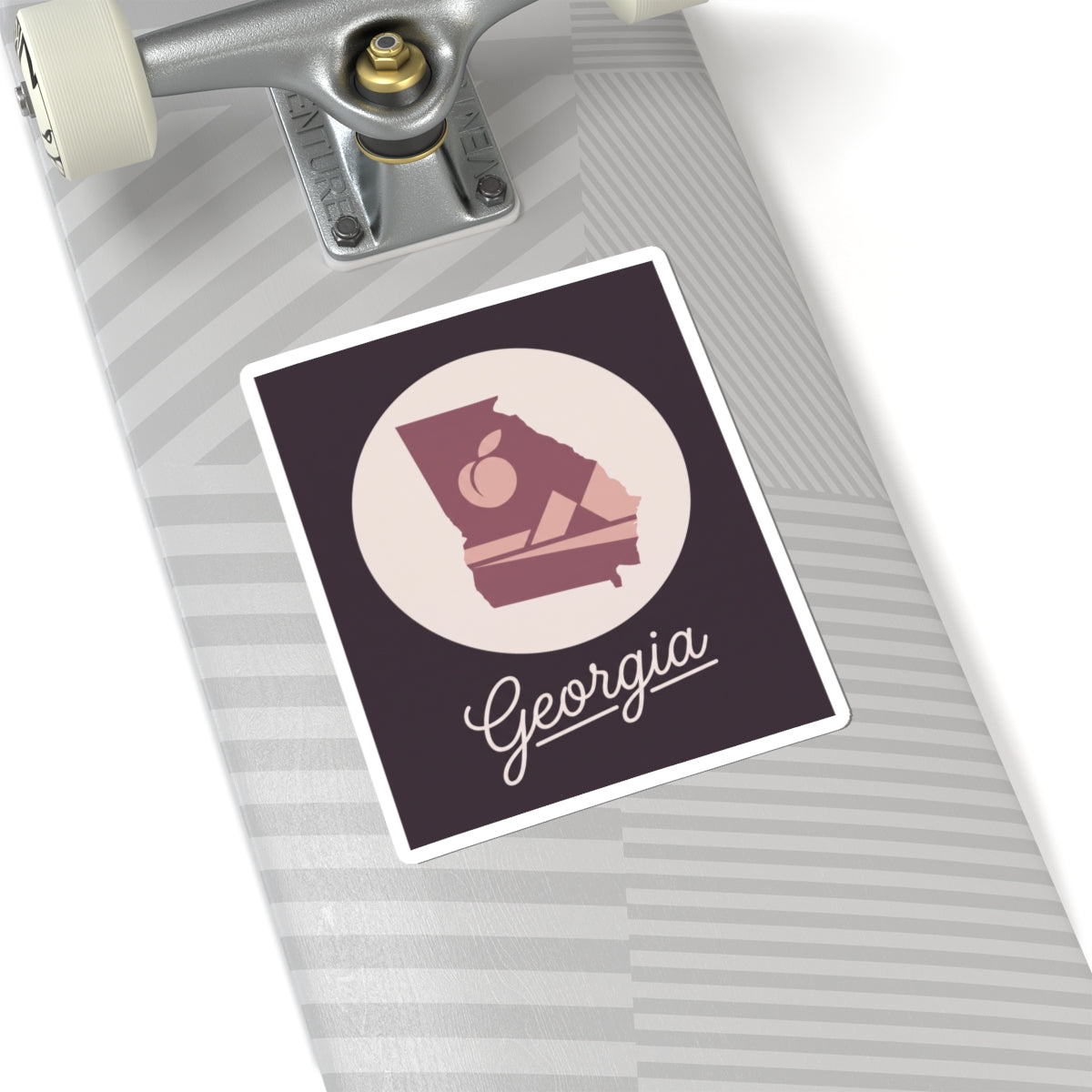 Mauve Georgia state silhouette vinyl decal with circular emblem and cursive Georgia script